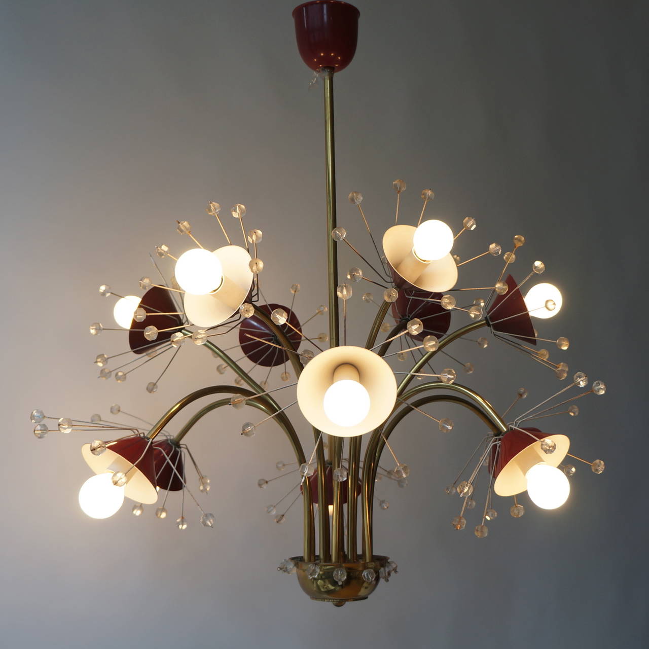 Emil Stejnar chandelier in red and glass, Austria. Beautiful chandelier from the 1950s featuring 12 lights (small bulbs e14).
Measures: Diameter 80 cm.
Height 80 cm.
  