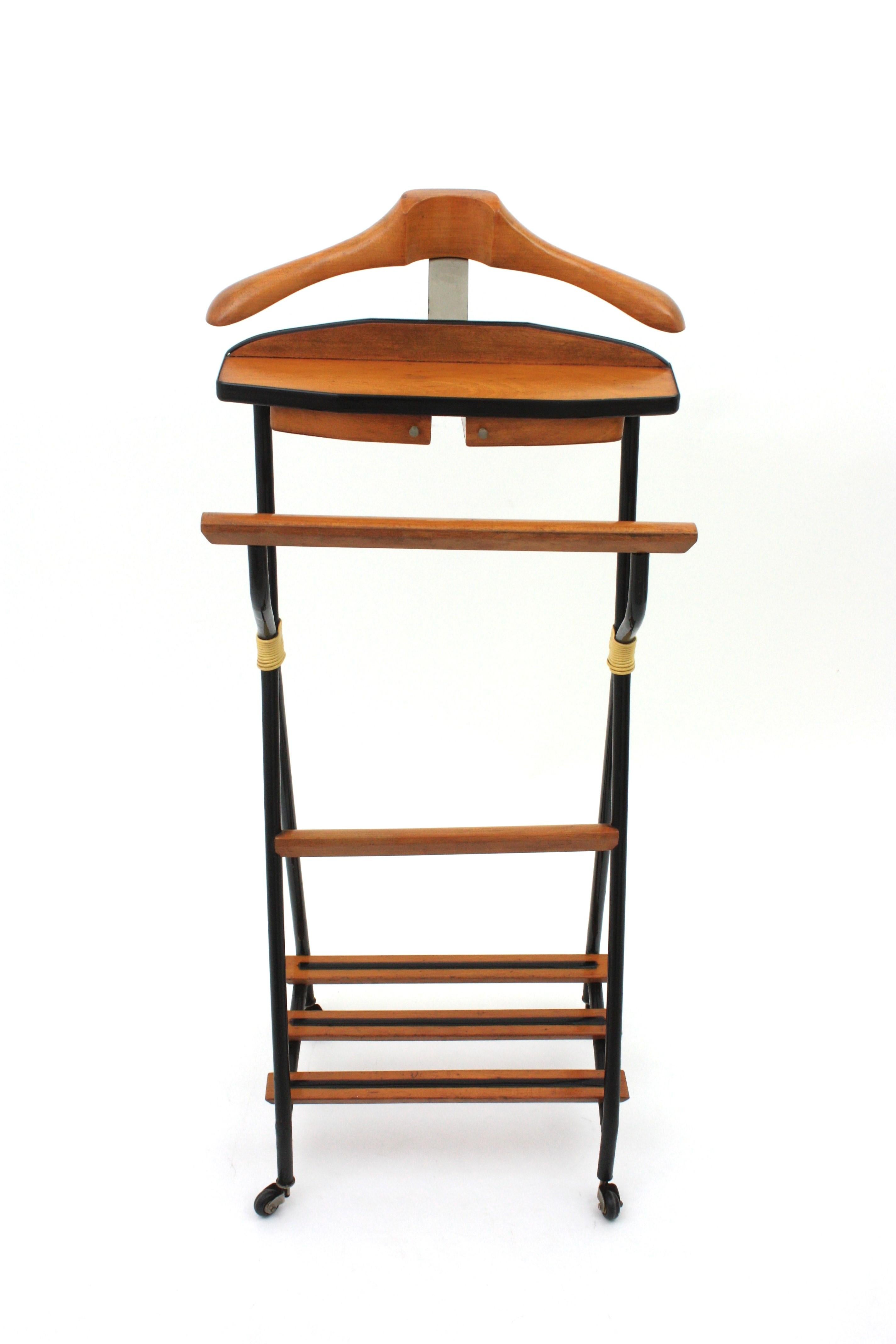 Italian 1950s Clothes Valet Stand with two drawers, Wood and Black Lacquered Metal
Italian Rolling Valet or Coat Stand in Wood and Metal
This outstanding dressboy valet stand features a beech wood structure with acrylic details. It has a nice design