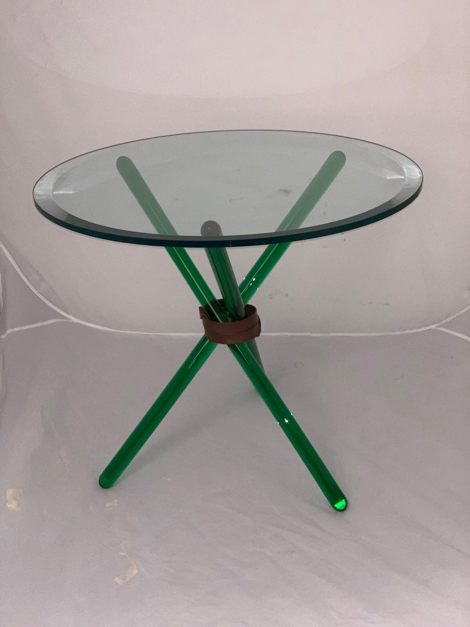 A coffee table produced by Seguso in 1950.Beautiful green cut-ground glass and copper belt, imitation leather tightened around the legs, Italian, 1950.