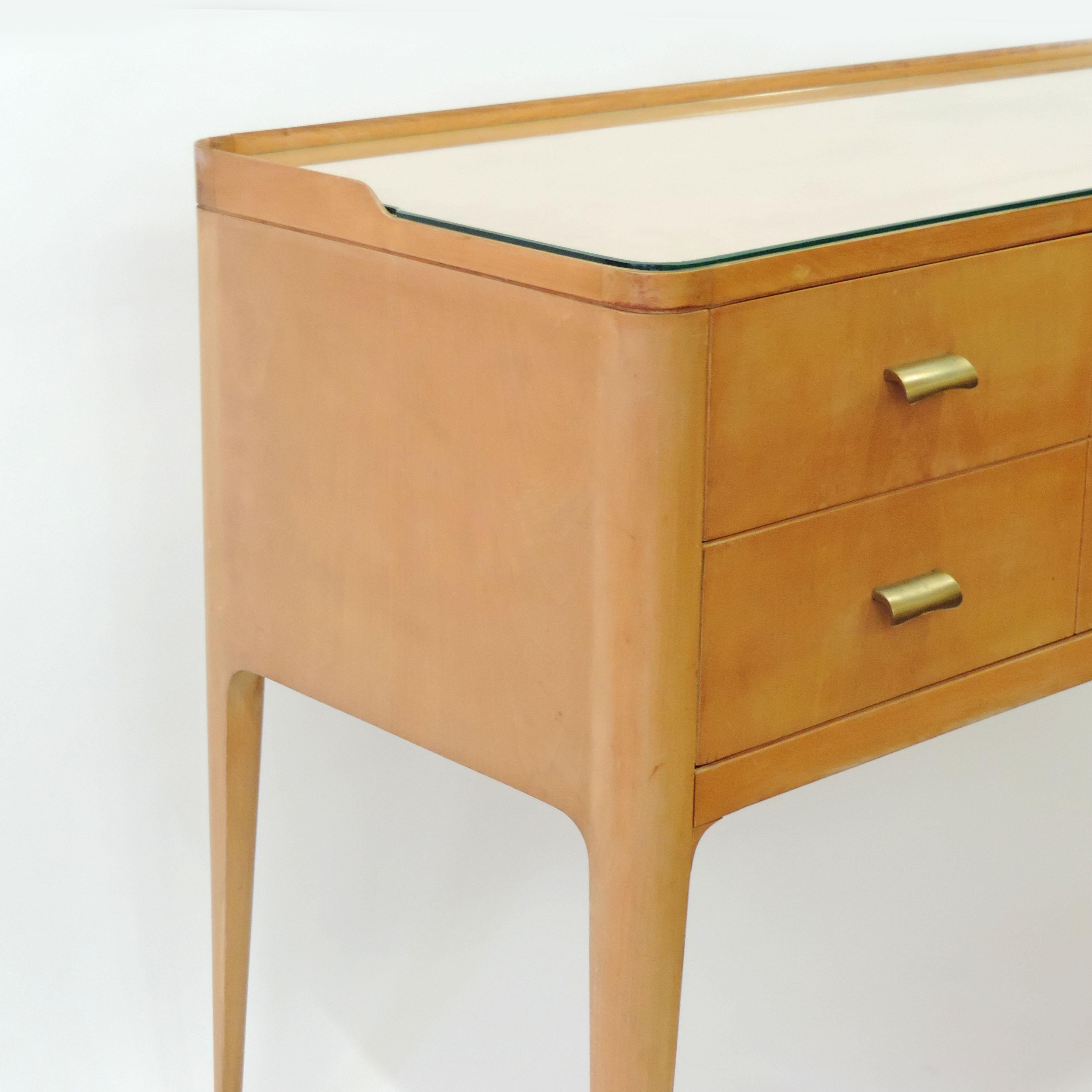 Italian 1950s curved wooden sideboard with brass handles and feet and a glass top.
4 drawers.