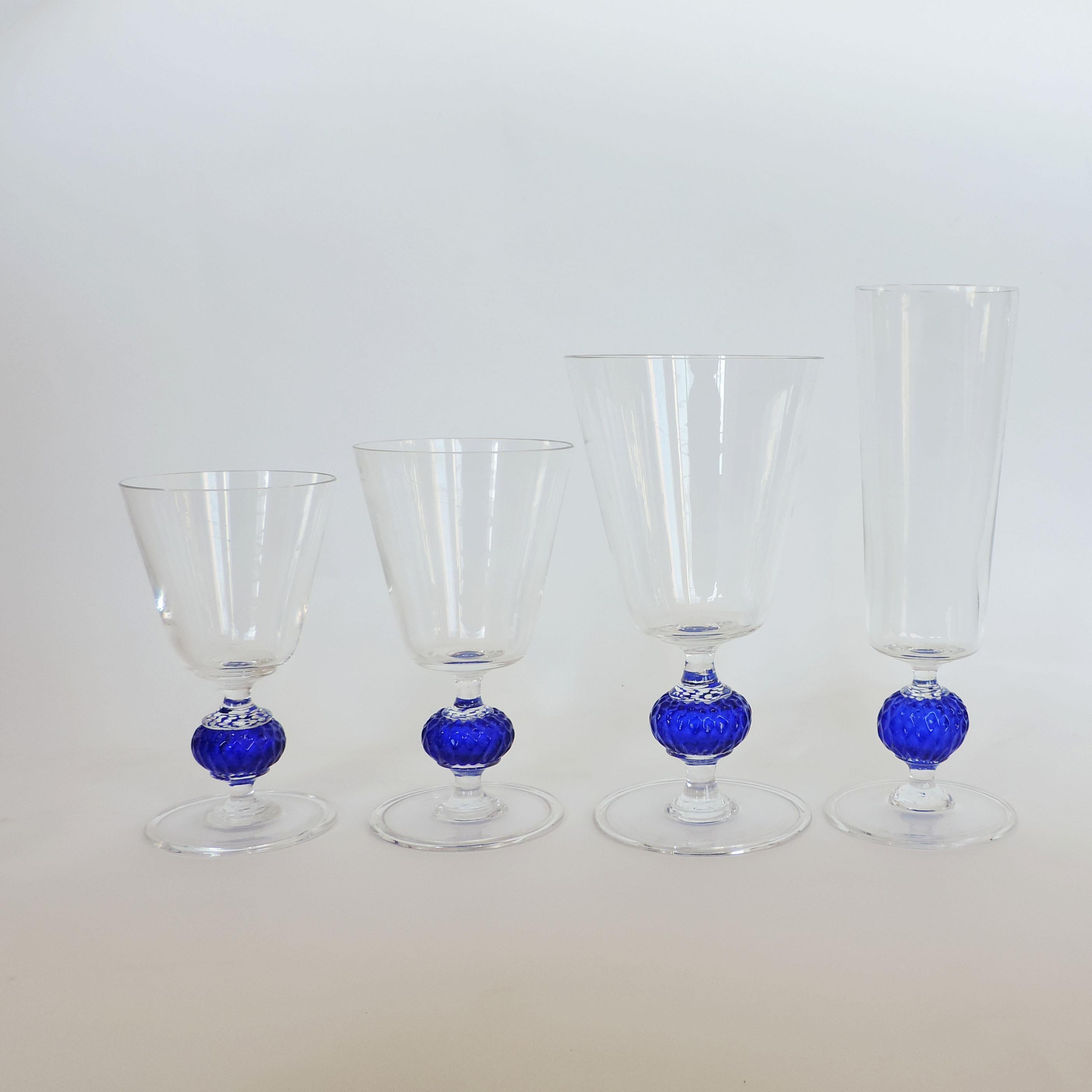 Italian 1950s hand blown Murano glass set of 40 drinking glasses.
10 Pieces per shape
Transparent and Blue glass.

