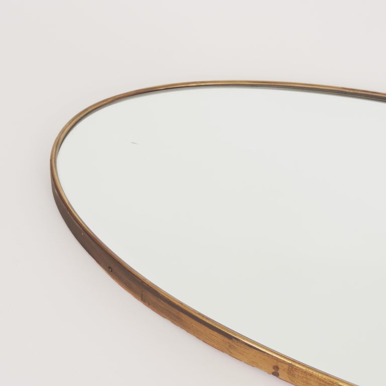 Mid-Century Modern Italian 1950s Oval Brass Framed Glass Mirror For Sale