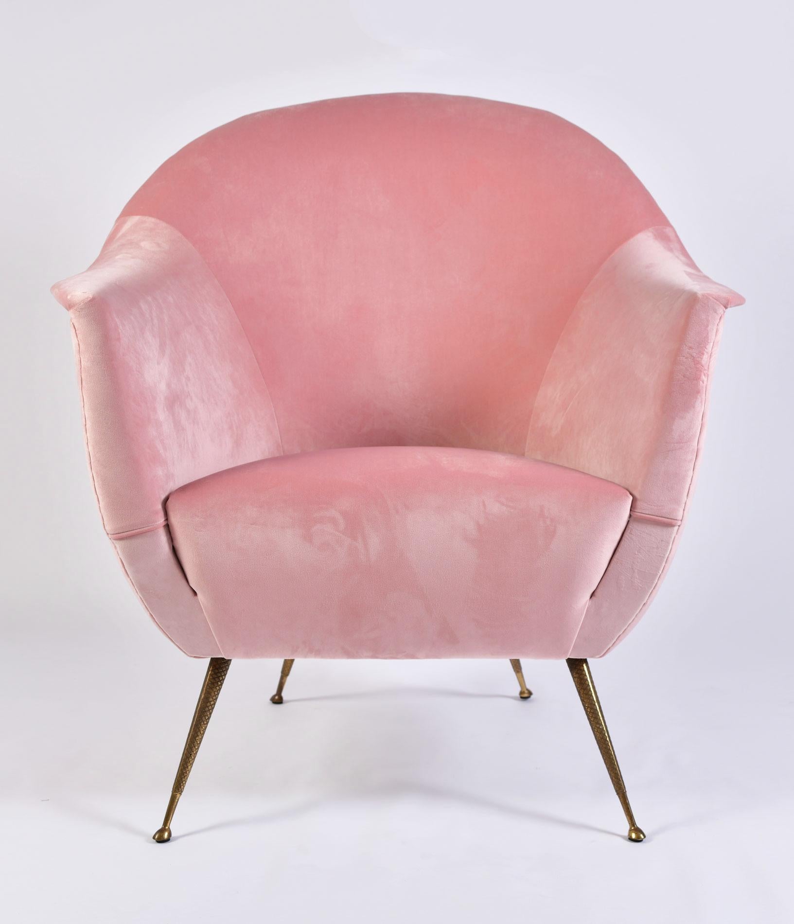 Luxuriously shaped pair of midcentury Italian armchairs recently re-upholstered in
softest pale pink velvet.
Dull gold tapered legs are etched in subtle criss-cross pattern.
 
