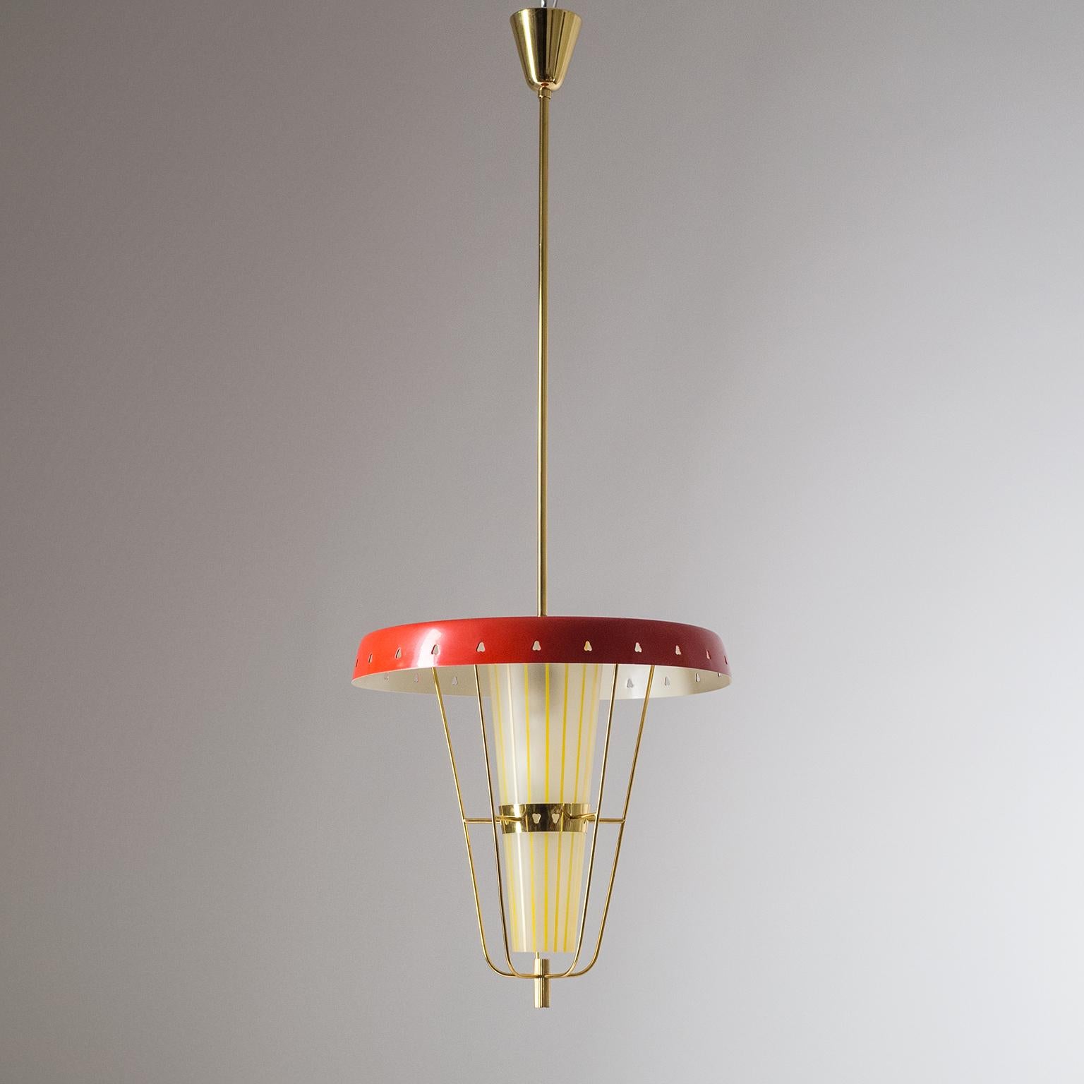 Rare Italian lantern from the 1950s. Wonderful modernist design with attention to detail: The unusual heart-shaped perforations in the large shade and the brass glass holder; the filigrane brass wire structure; the striped and conical glass