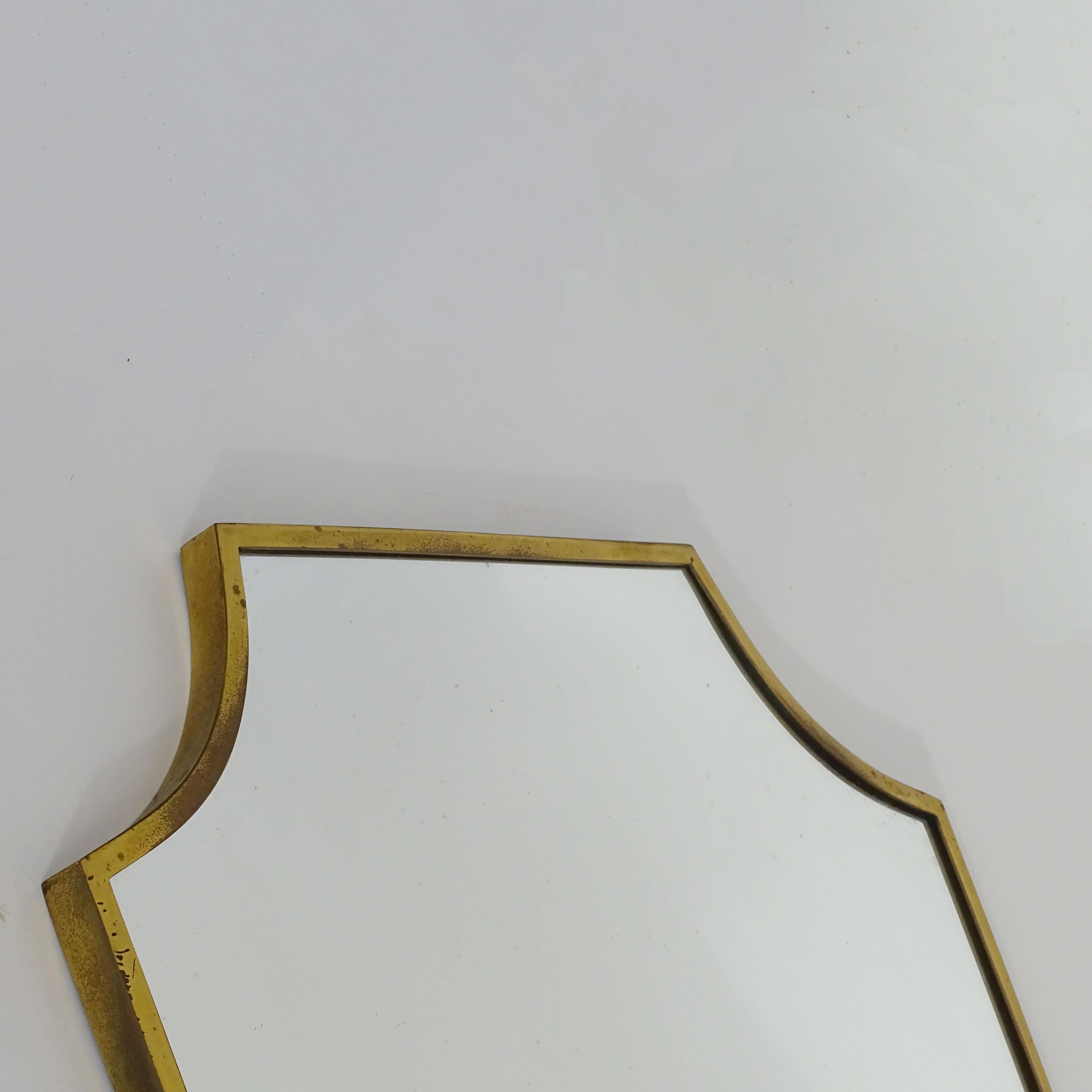 Italian 1950s Shield Shaped Brass Frame Wall Mirror In Good Condition For Sale In Milan, IT