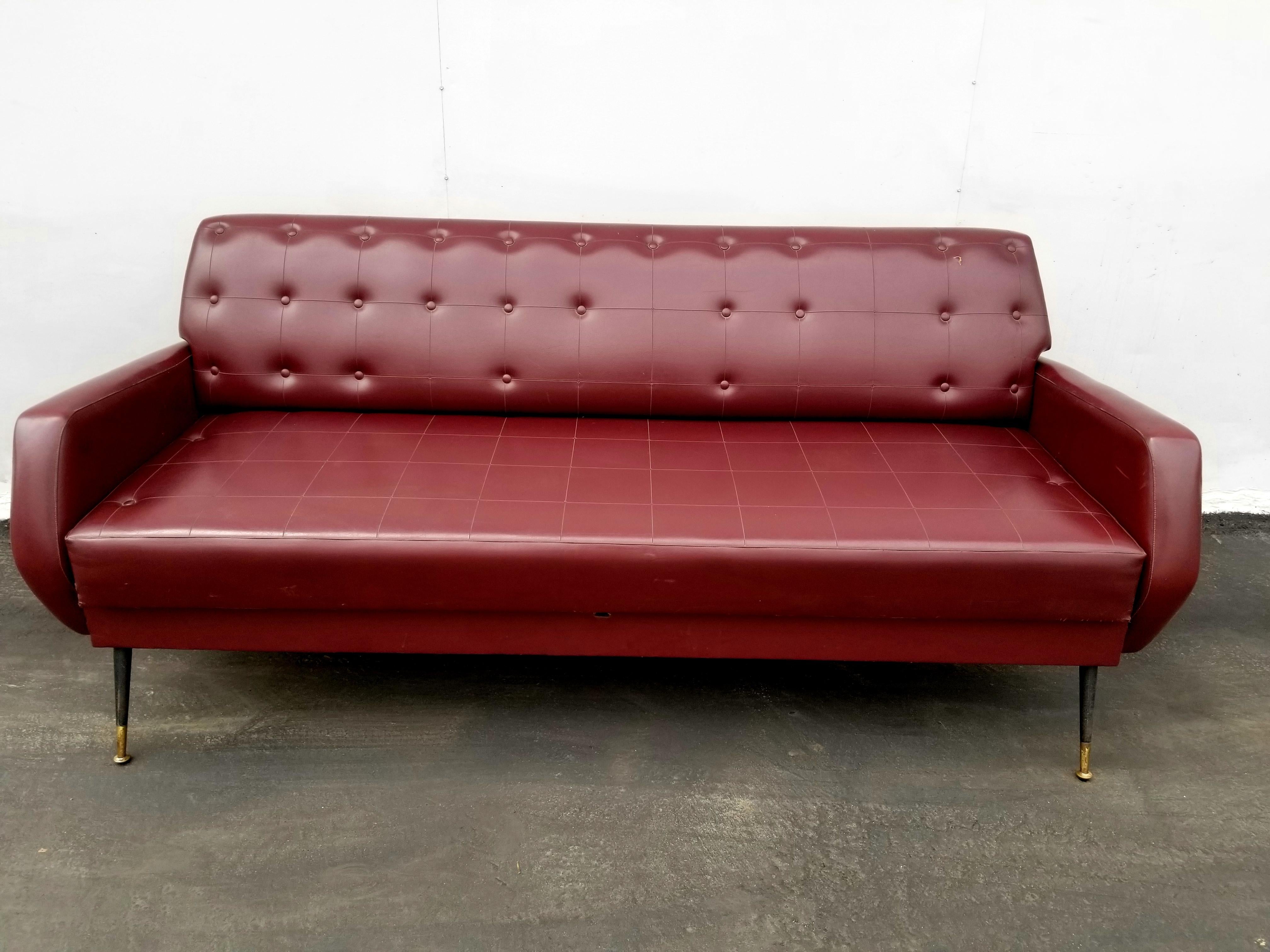Italian sofa, original upholstery brass and metal lags.