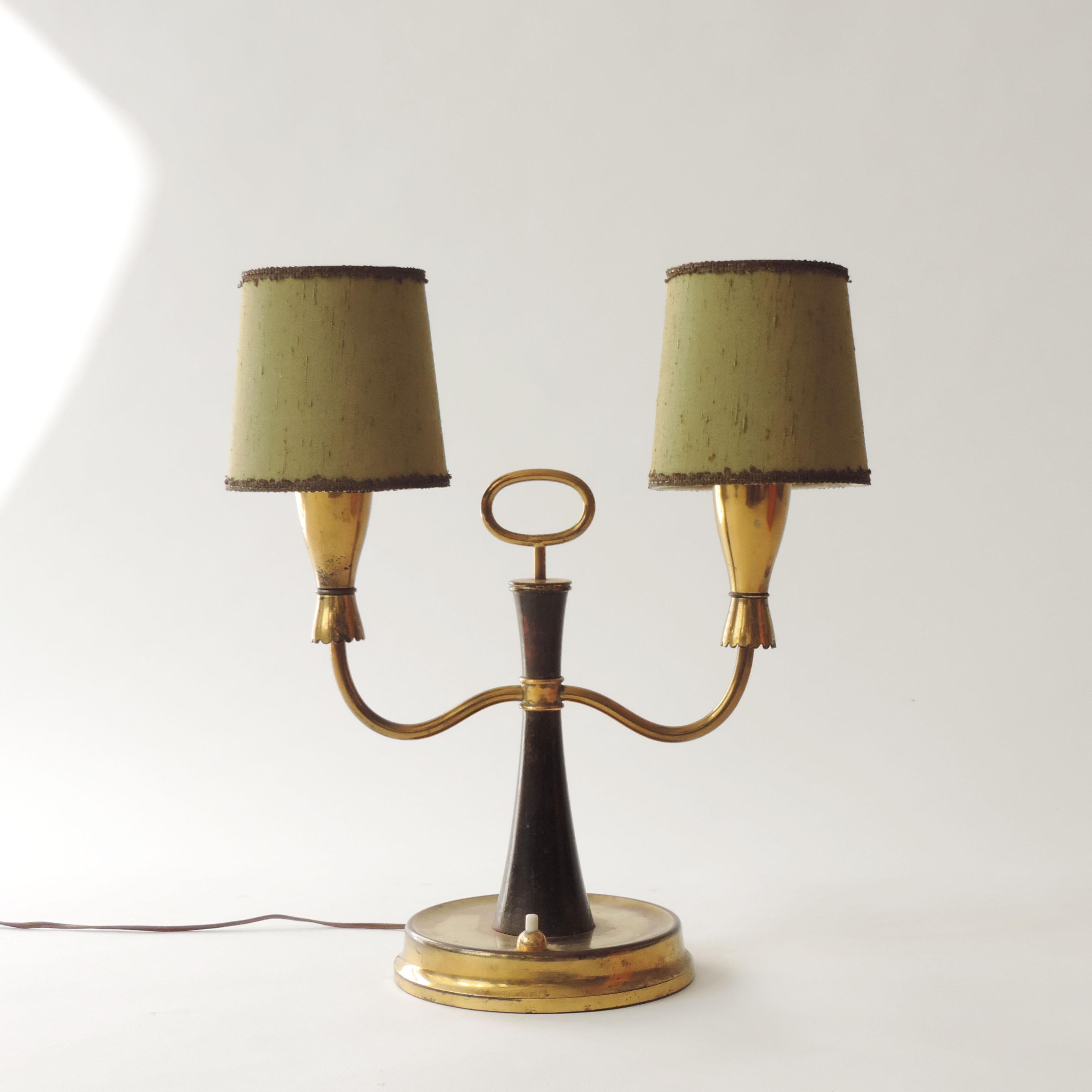Italian 1950s two light table lamp in wood and brass
Attributed to Cesare Lacca.
