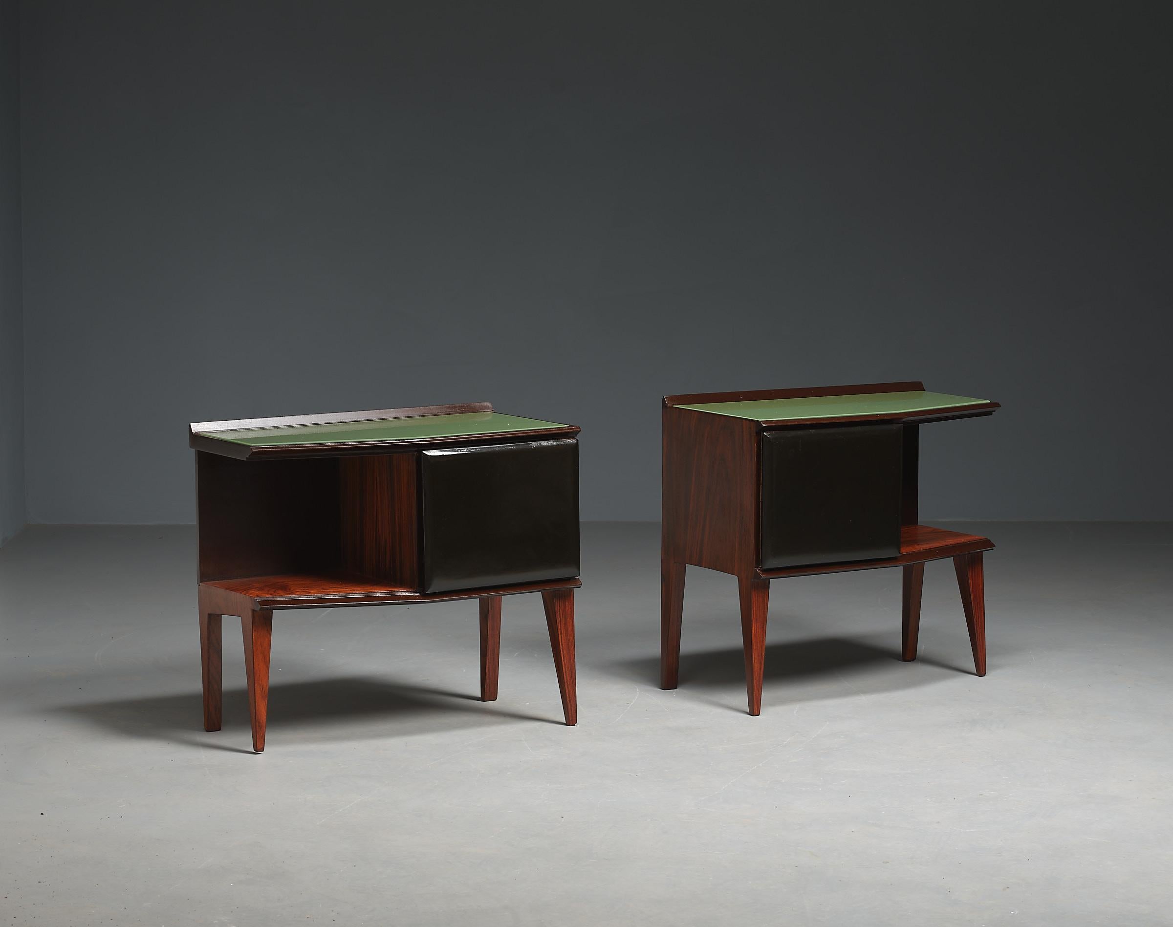Discover a pair of authentic Italian 1950s bedside tables, showcasing the pinnacle of Italian craftsmanship. These remarkable pieces have been meticulously restored to their original glory, with a restyling by RETRO4M, while staying true to the