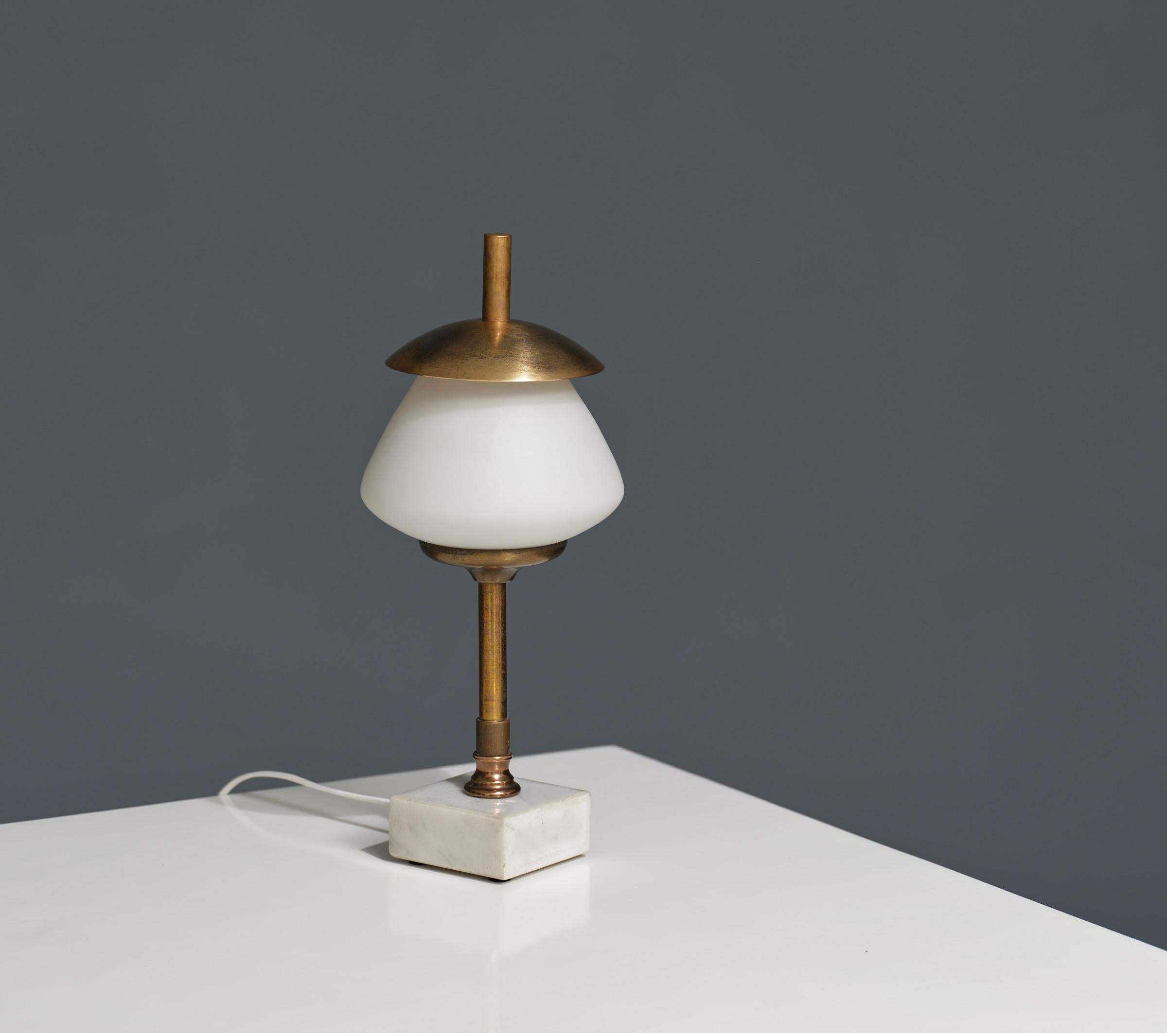 Elevate your decor with this exquisite Italian table lamp hailing from the iconic 1950s era. Meticulously restored and restyled by RETRO4M, this lamp embodies the essence of Italian design heritage. Its elegant features include a sturdy cubic marble