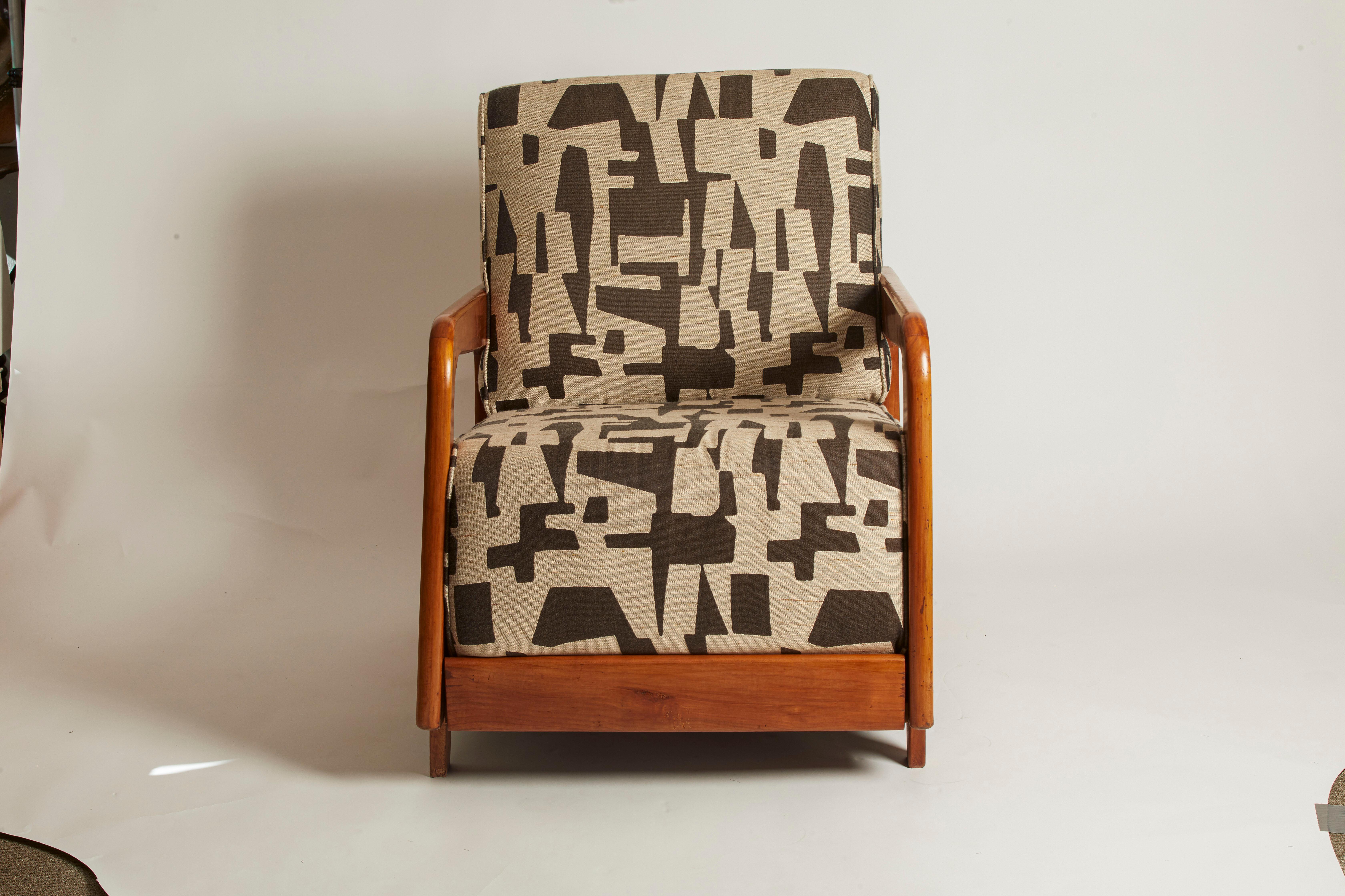 Italian 1950's Walnut Armchair restored and reupholstered in jacquard fabric. This unique chair is in pristine condition.