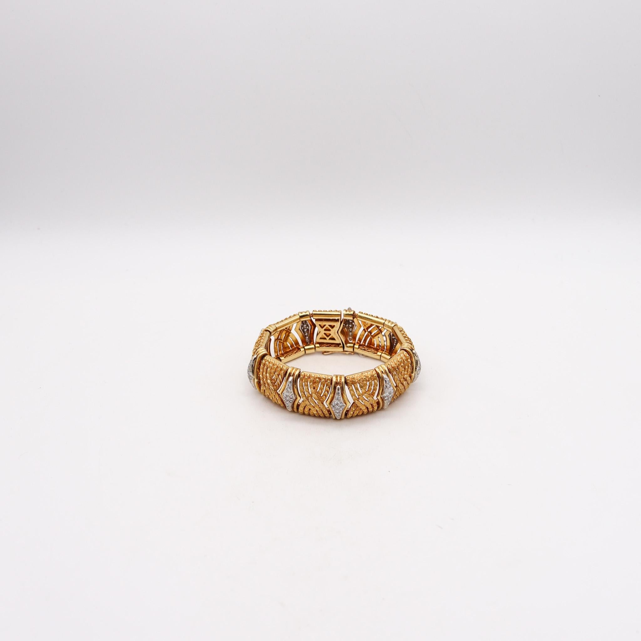 Italian mid century bracelet with diamonds.

Great bold, massive and textured bracelet with fabulous eye appeal, created in Italy during the mid century period, circa 1970. Composed by multiples rectangular links made un in solid yellow gold of 18