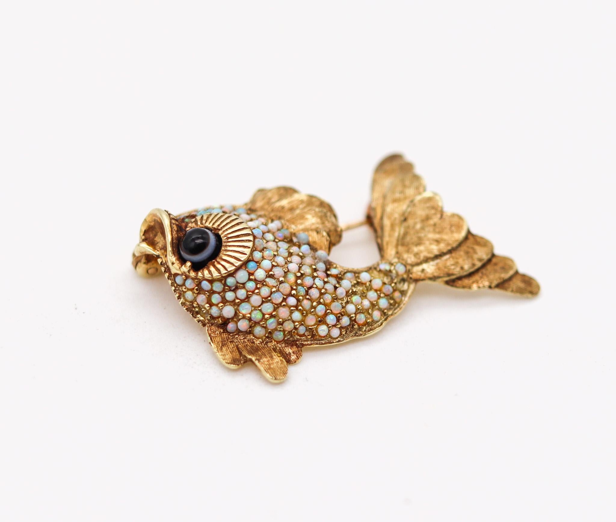 Modernist fish brooch with Australian Opals.

Magnificent fish brooch, created in Italy back in the 1960. This little fish has been crafted with fabulous intricate details in solid yellow gold of 18 karats. Fitted with a hinged bar with a mechanical