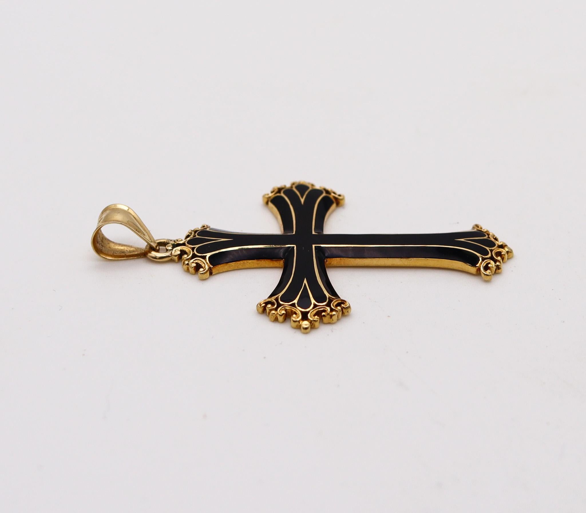 A neo-gothic enameled cross.

Very nice and unusual highly decorated cross designed in Italy with neo-gothic patterns. The vintage cross was crafted in solid rich yellow gold of 18 karats with high polished finish and embellished with applications
