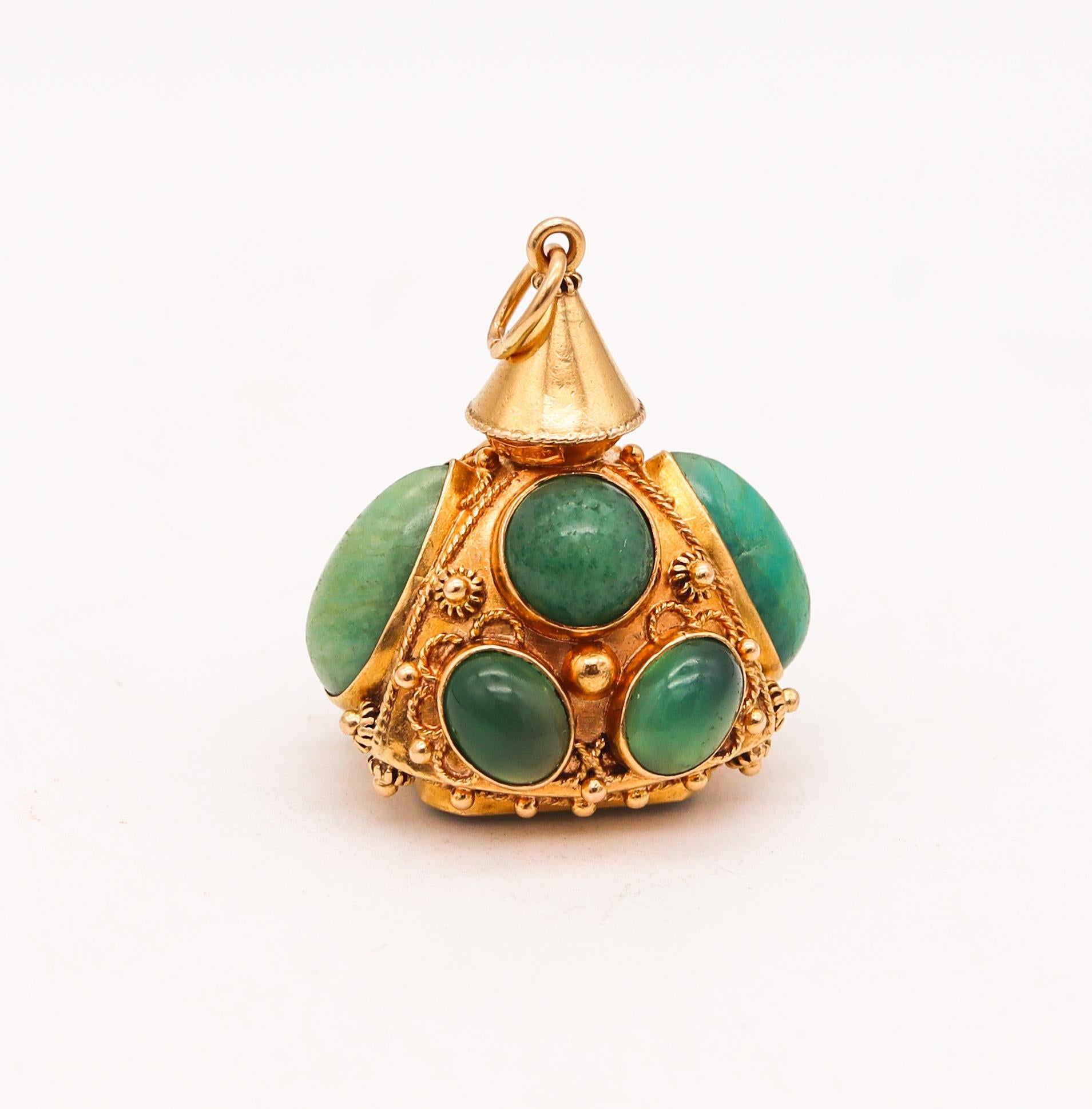 Italian mid century gem set vintage charm.

An Etruscan revival piece, created in Italy during the mid century period, circa 1960. This beautiful charm pendant has been crafted in solid yellow gold of 18 karats with polished and textured finish.