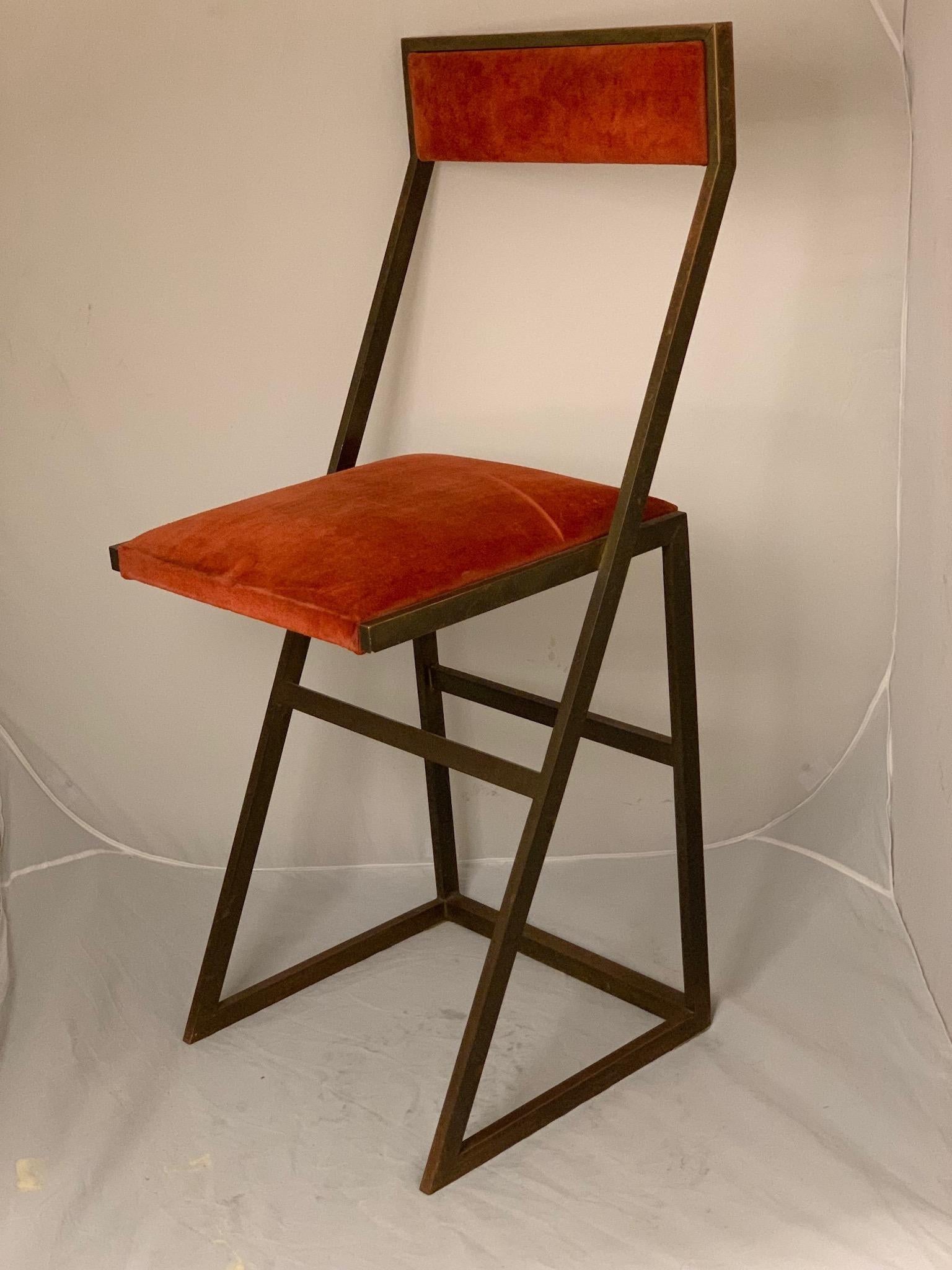 A pair of bar stools in brass and orange velvet in original condition. By Romeo Rega, Italian, 1970s.