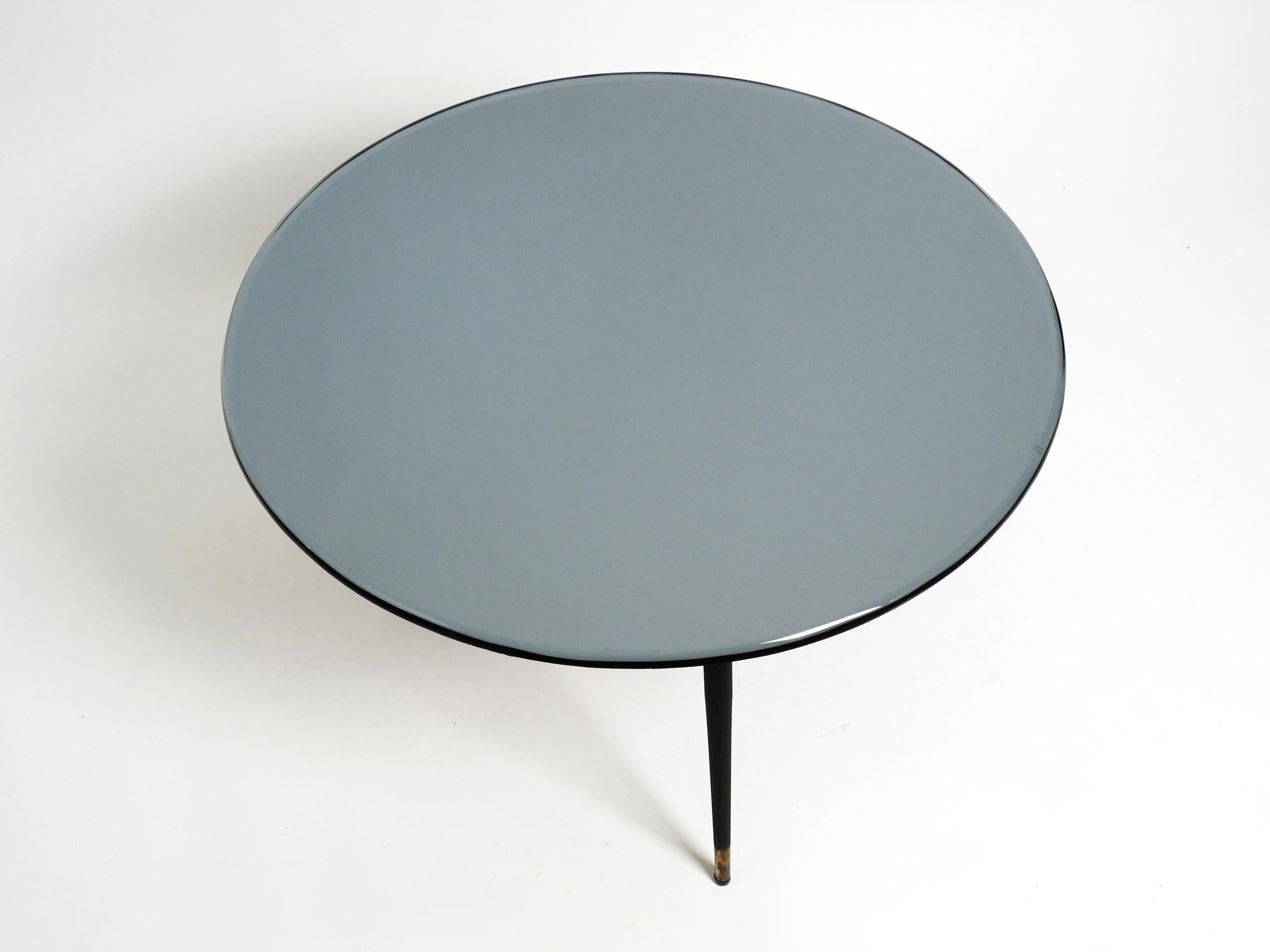 Mid-Century Modern Italian 1960s blue gray round mirrored glass side table with metal tripod base For Sale