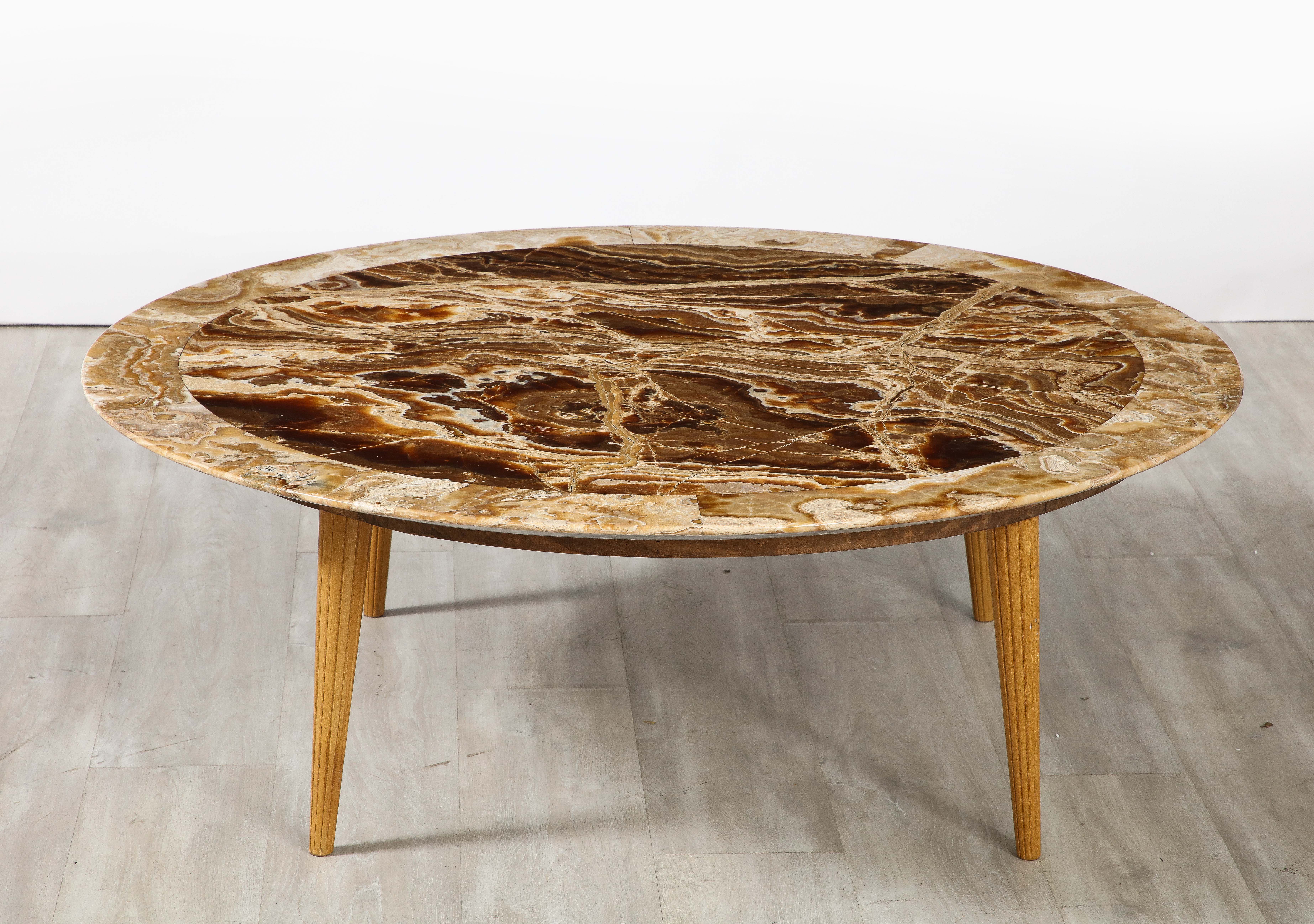 Italian 1960's grand circular coffee table, the top in a spectacular agate, with the outer border being a lighter coloration which highlights the central section and oak legs wonderfully.  The top rests upon four fluted and tapered oak legs.  The