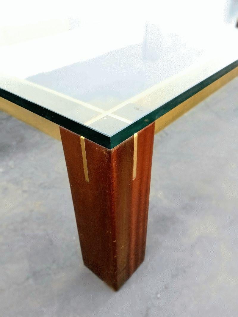 Italian coffee table after Milo Baughman , brass and wood base and the 3/4 of inch glass top, brass base profile is 1/2 inch.
Shipping USA continental  in home delivery 2-4 weeks $400 