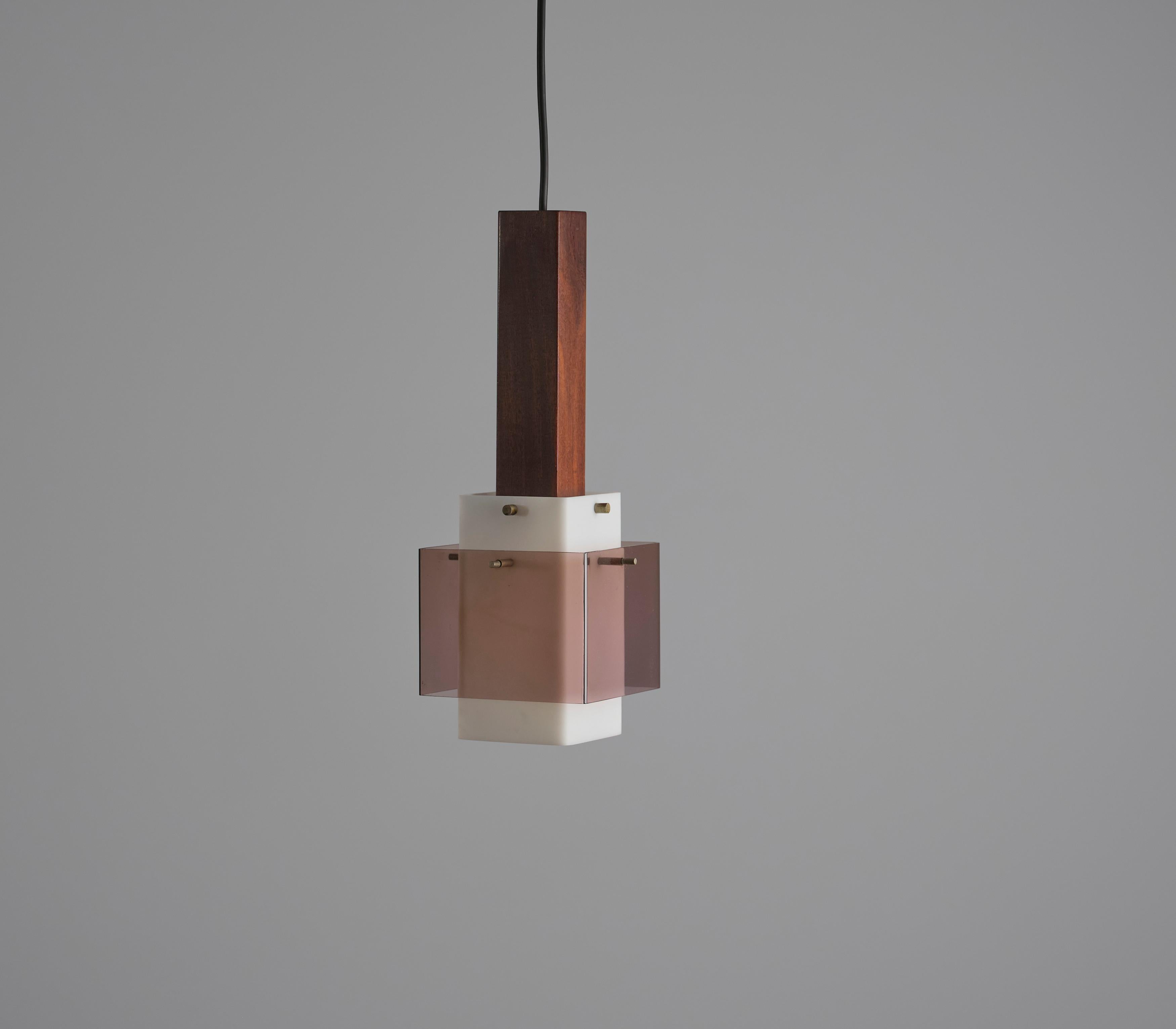 Presenting this exquisite Italian pendant lamp hailing from the 1960s. Crafted with a profound appreciation for design and quality, this lamp features a rich, dark teak wooden structure. The centerpiece of this pendant is the milk perspex shade,