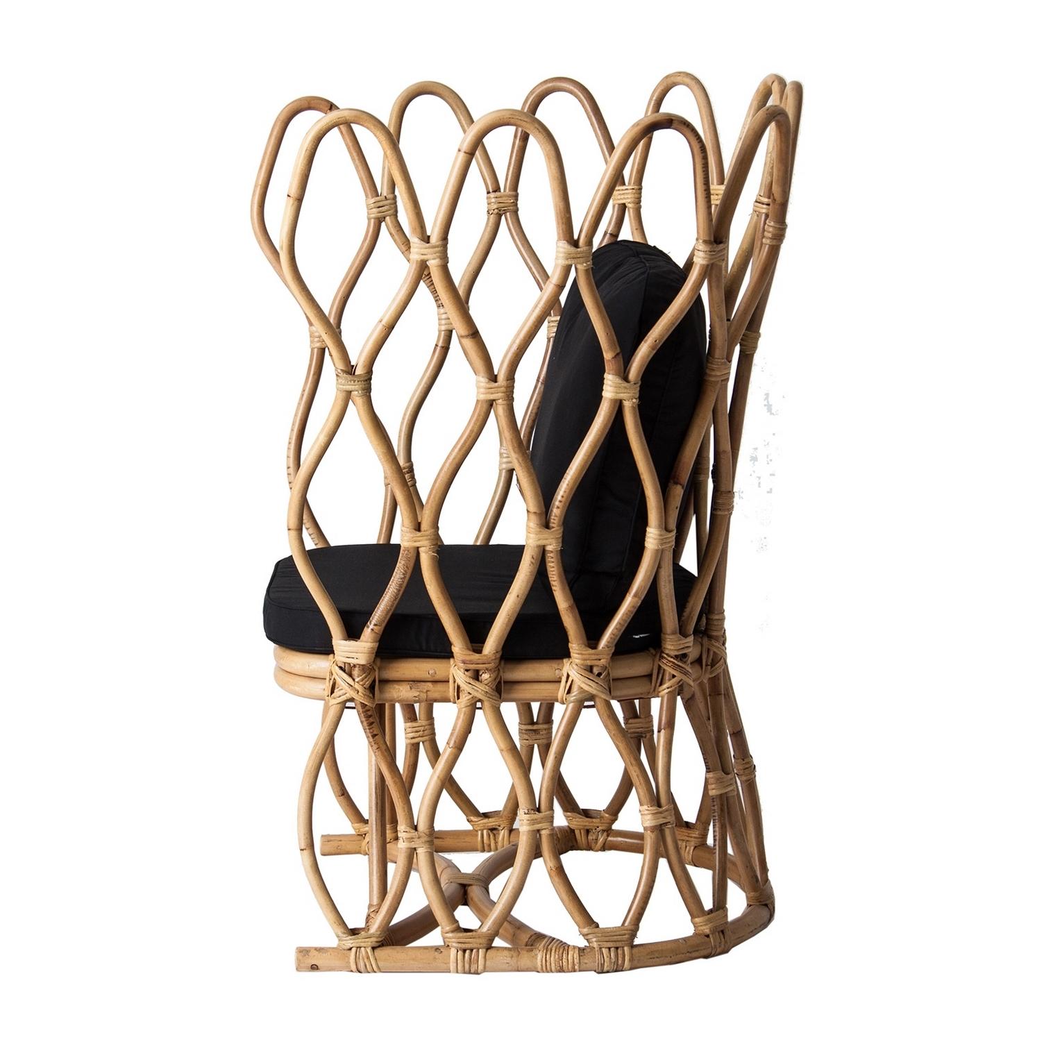 Design and original lounge armchair with a natural rattan airy structure.
