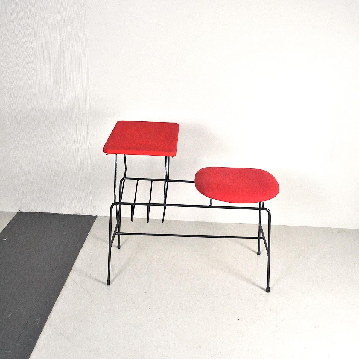 A typical small Italian 1960s desk bench with seat and small top and carries magazines.
