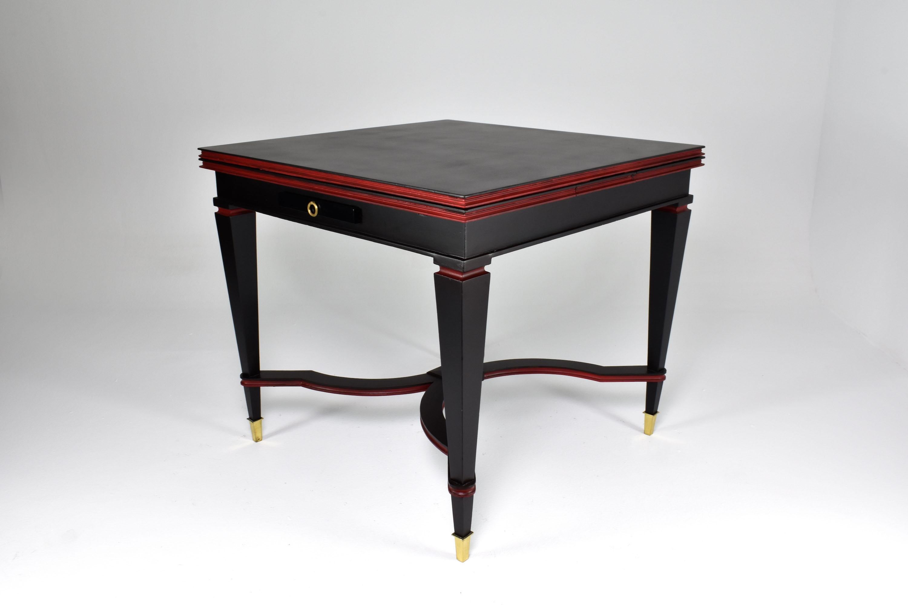 A square-shaped game table from the 1960s, made in Italy in an Art Deco style. It's extendable and can accommodate up to 4 people. The table has a criss-cross design on the bottom and curvaceous feet, showcasing excellent workmanship. It also