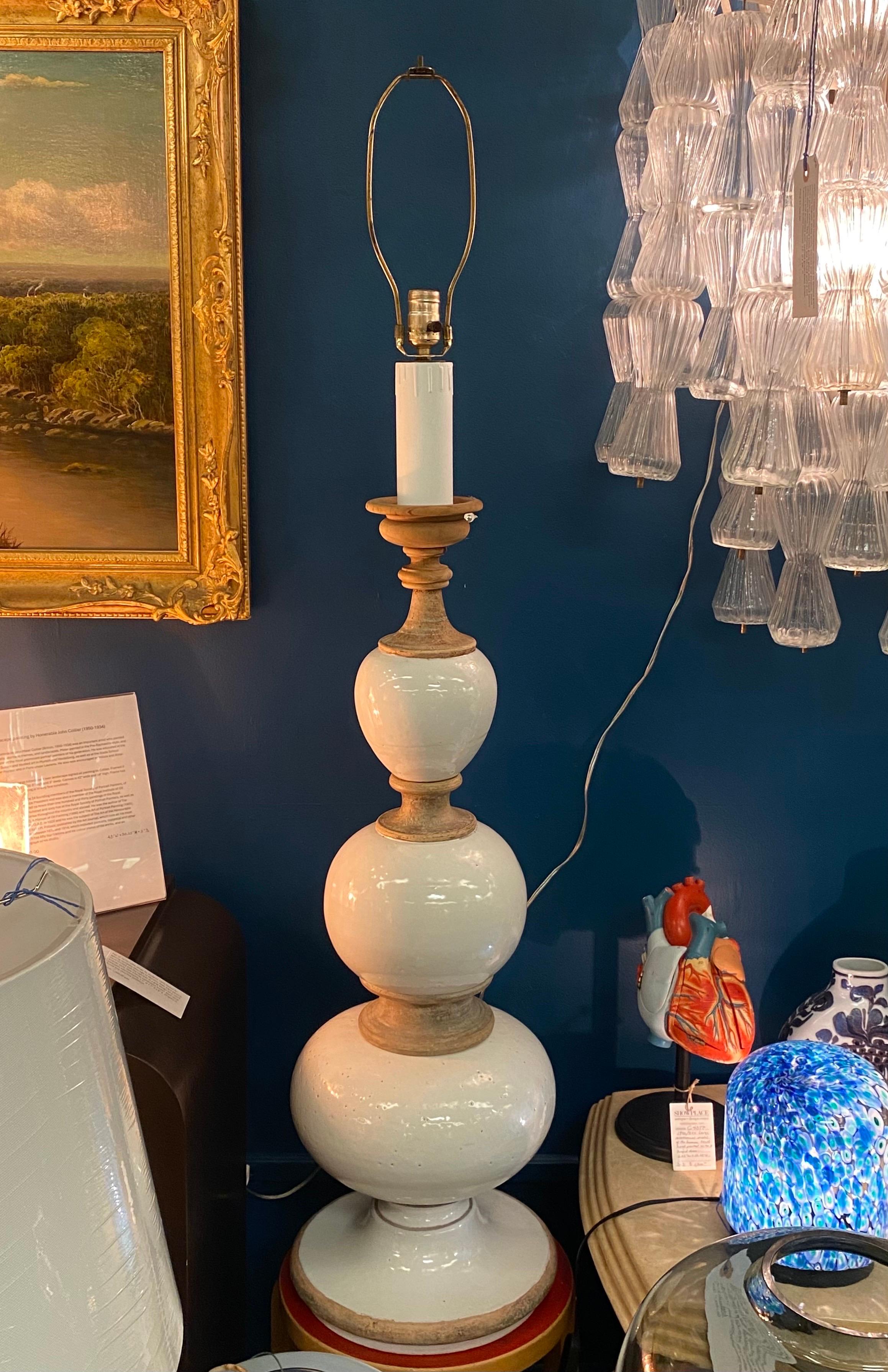 A monumental 1960s mid century table lamp by well know Italian ceramic company Ugo Zaccagnini. The lamp is made in section in white glazed and natural unglazed terracotta earthenware. The top candle holder style piece and the faux candle housing the