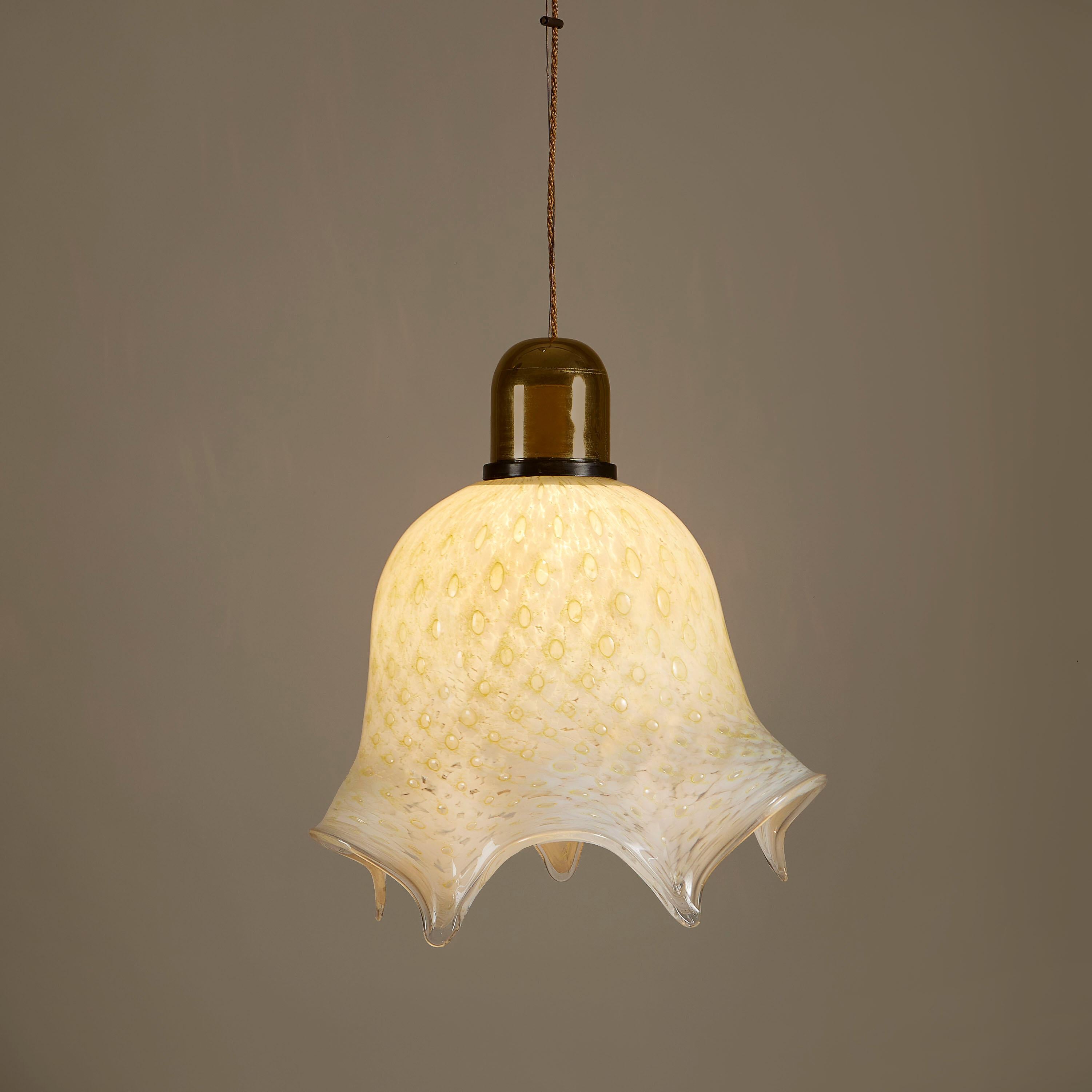 Handblown Murano glass sculpted into curved handkerchief shape using the fazzoletto technique. Substantial glass pendant but the patterning inside the glass gives the effect of delicate lace. Brass domed fitting and ceiling rose. Height can be