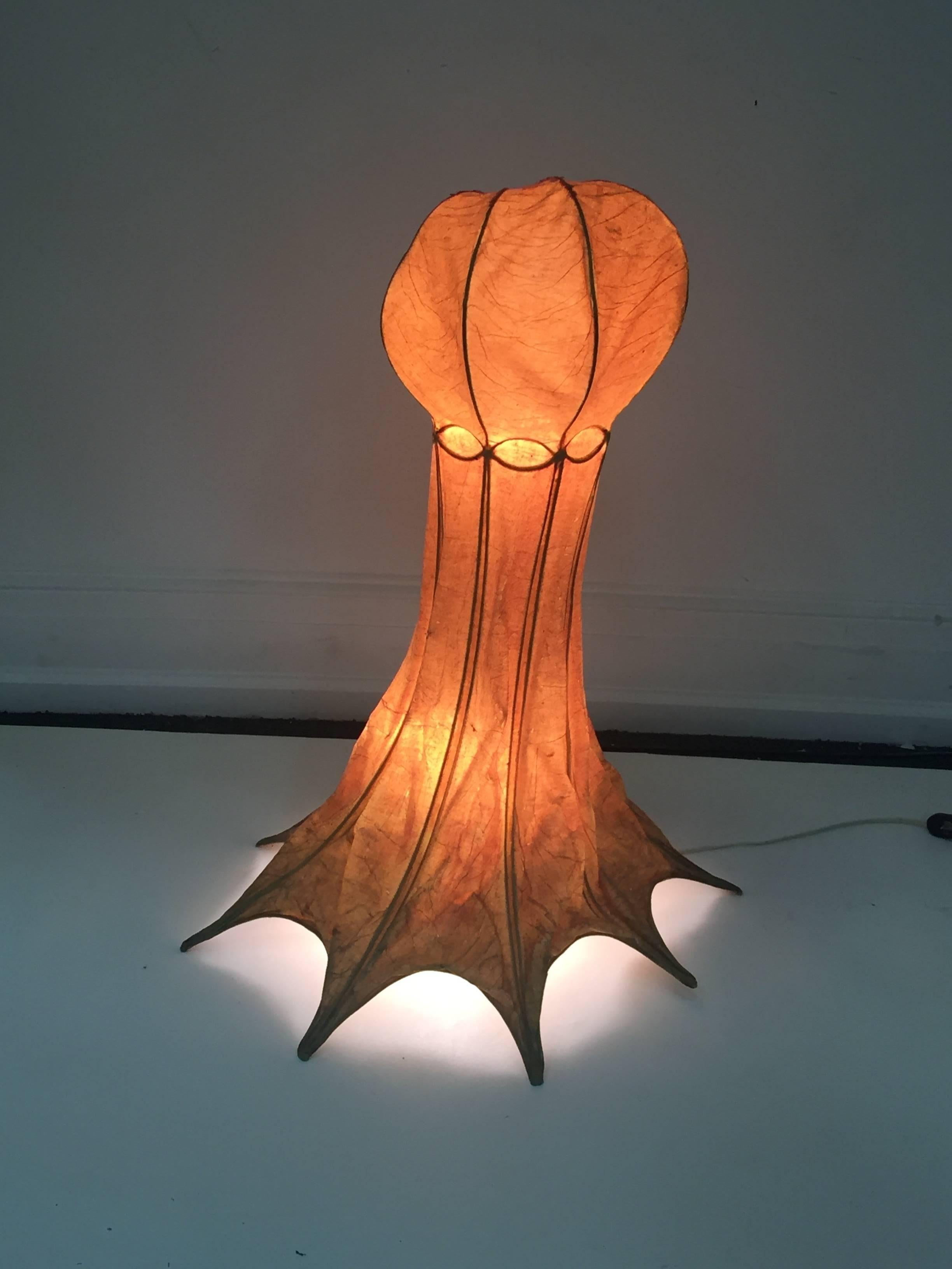 Interesting parchment over wire form sea octopus or another depicted sea creature lamp. Created in the 1960s in the manner of Afra and Tobia Scarpa this creature has an eight footed base. Diameter of the head is 13 inches.