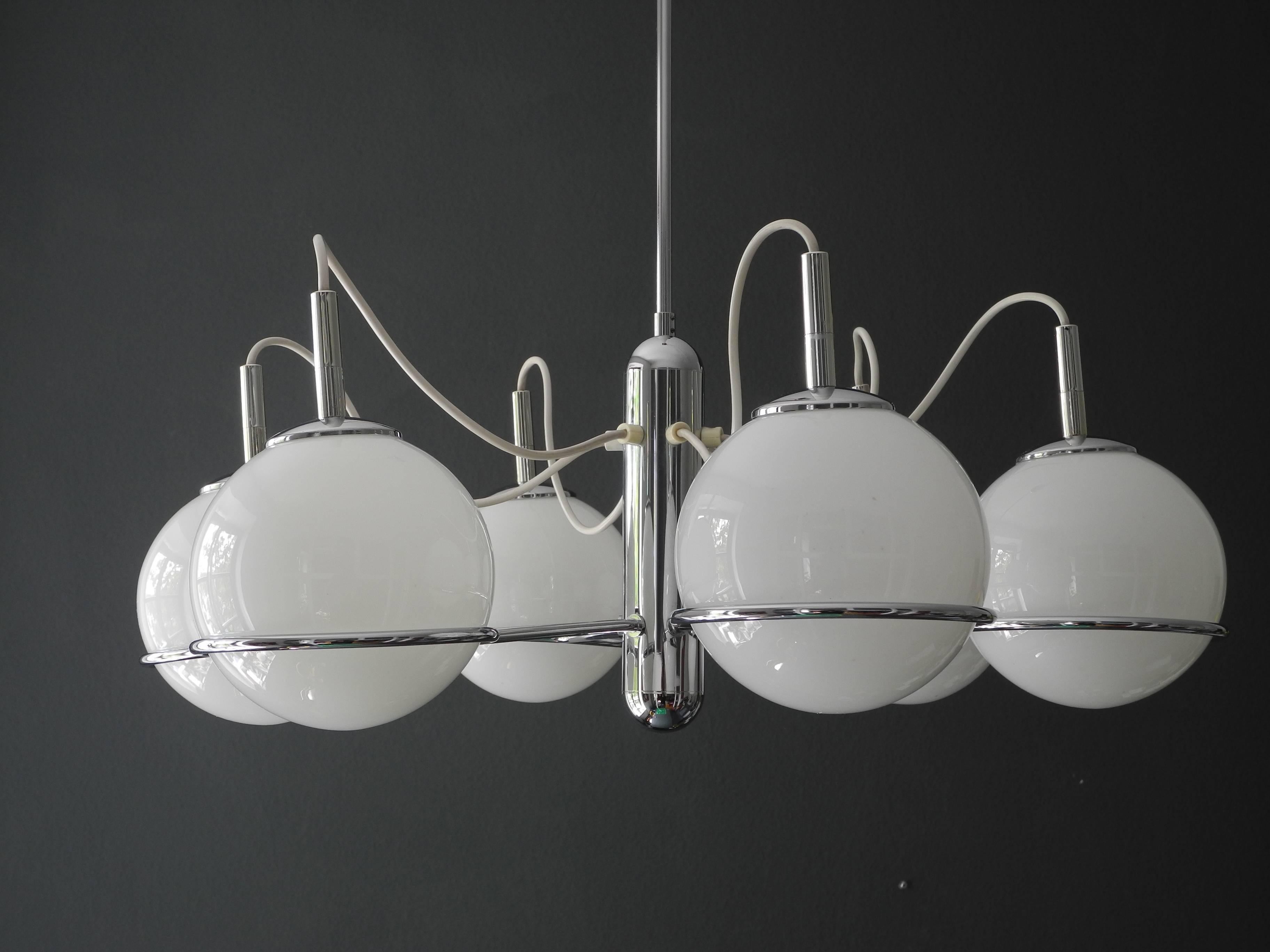 Italian 1960s Pop Art Space Age chrome ceiling lamp with six glass spheres.
The glass balls are simply placed on the rack. Great pop art design in impeccable condition.
Glare free pleasant light with six E14 sockets.
Very good vintage condition