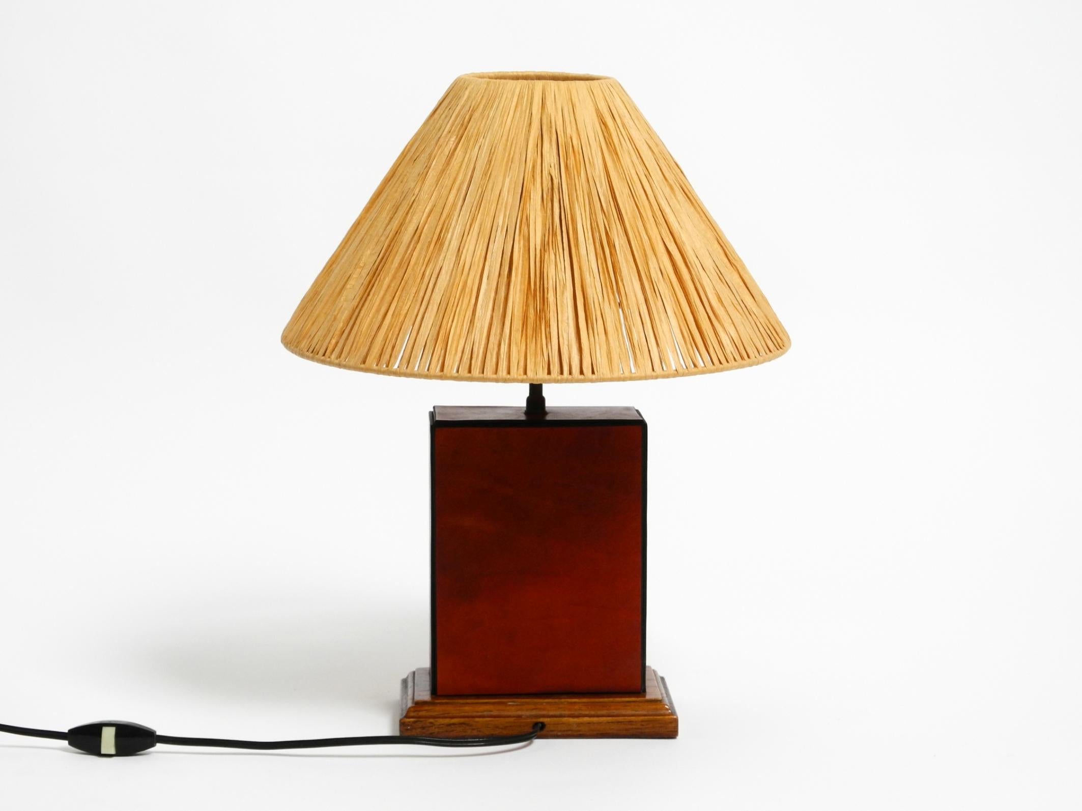 Mid-Century Modern Italian 1960s table lamp made of wood and leather with paper straw lampshade For Sale