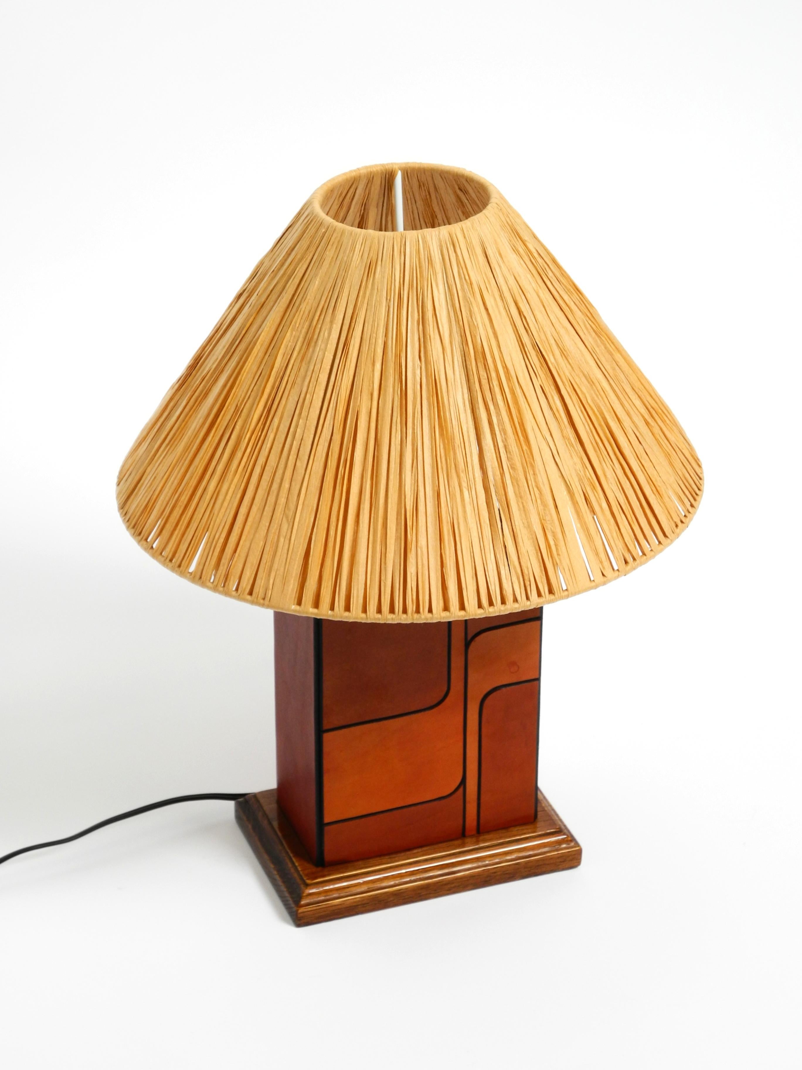 Leather Italian 1960s table lamp made of wood and leather with paper straw lampshade For Sale
