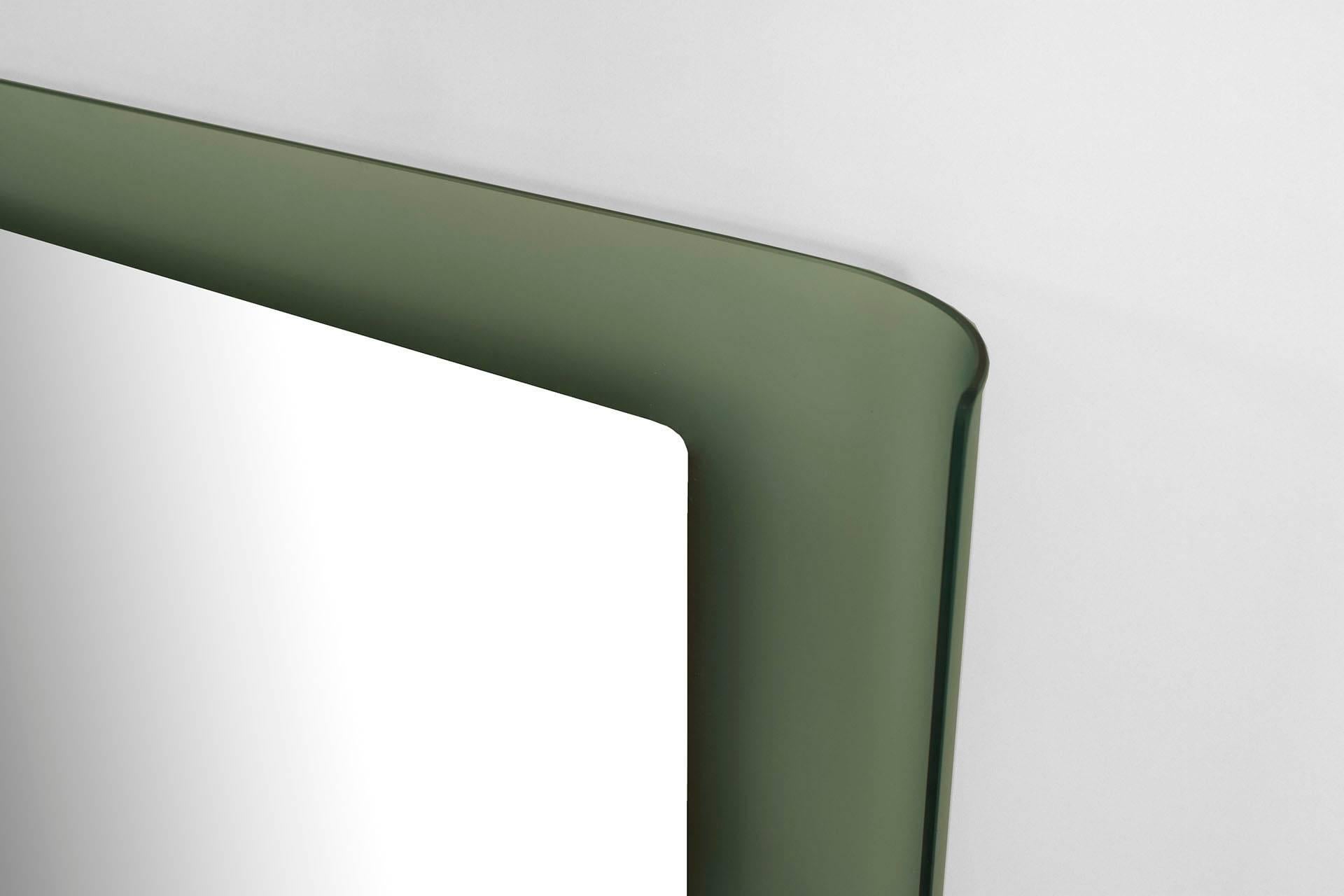 Italian Mid-Century (1960s) wall mirror with a large rectangular frosted glass back panel with curved sides behind a rectangular mirror. (by FONTANA ARTE)
