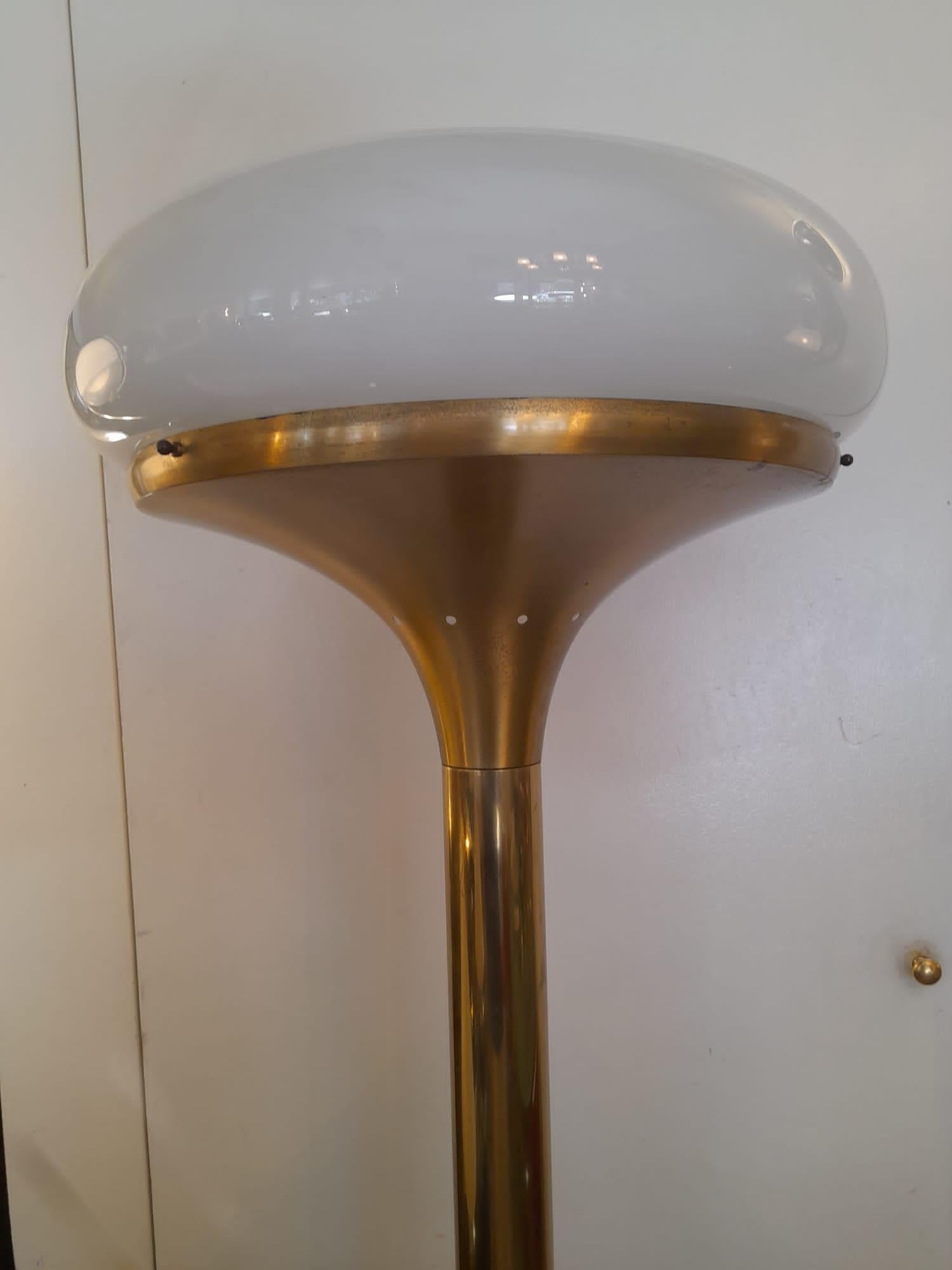 Italian 1970s brass and white glass lampshade floor lamp.
Original wiring system, original foot button. 
This lamp features a white rounded glass which is in perfect conditions: no cracks. The brass of the structure shows some wears and signs