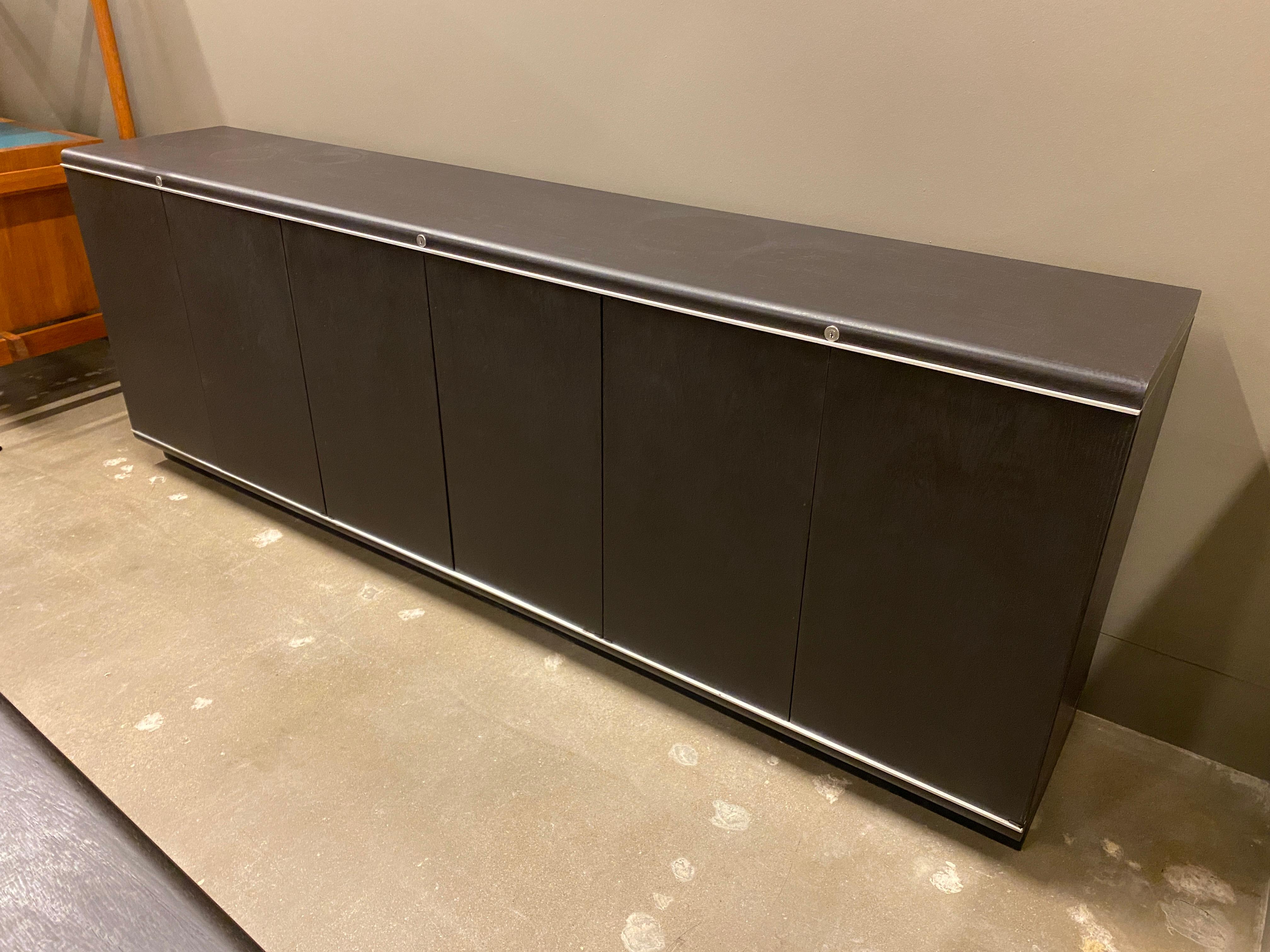 Wenge credenza with aluminum trim by Osvaldo Borsani and Eugenio Gerli for Tecno. Finish is semi-opaque very dark brown to ebony black.  See images for Tecno label, Italy, 1970s.
