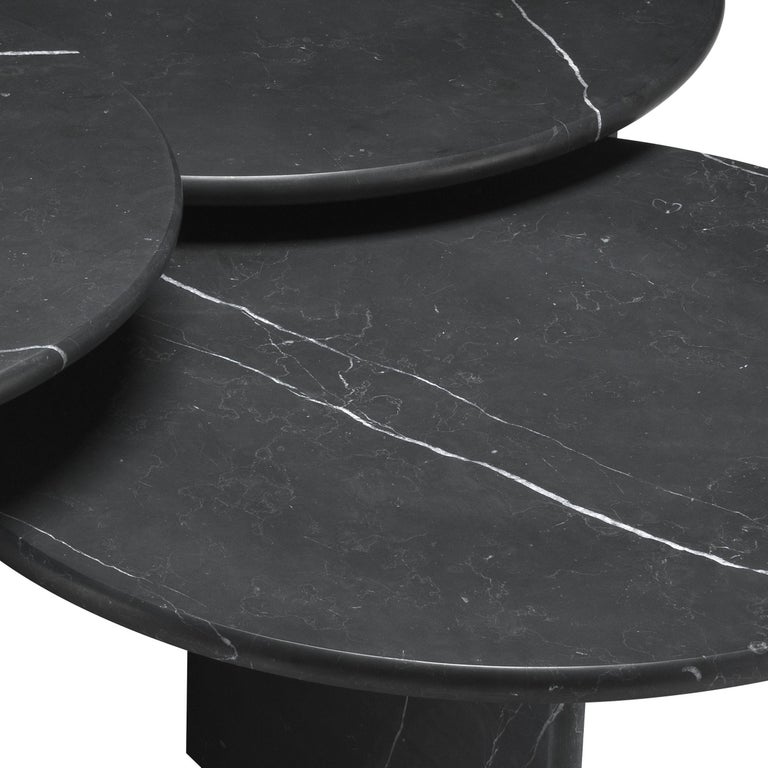 Graphic and Italian 1970s design style set of three coffee or nesting tables in black marble and drop shaped top.
 