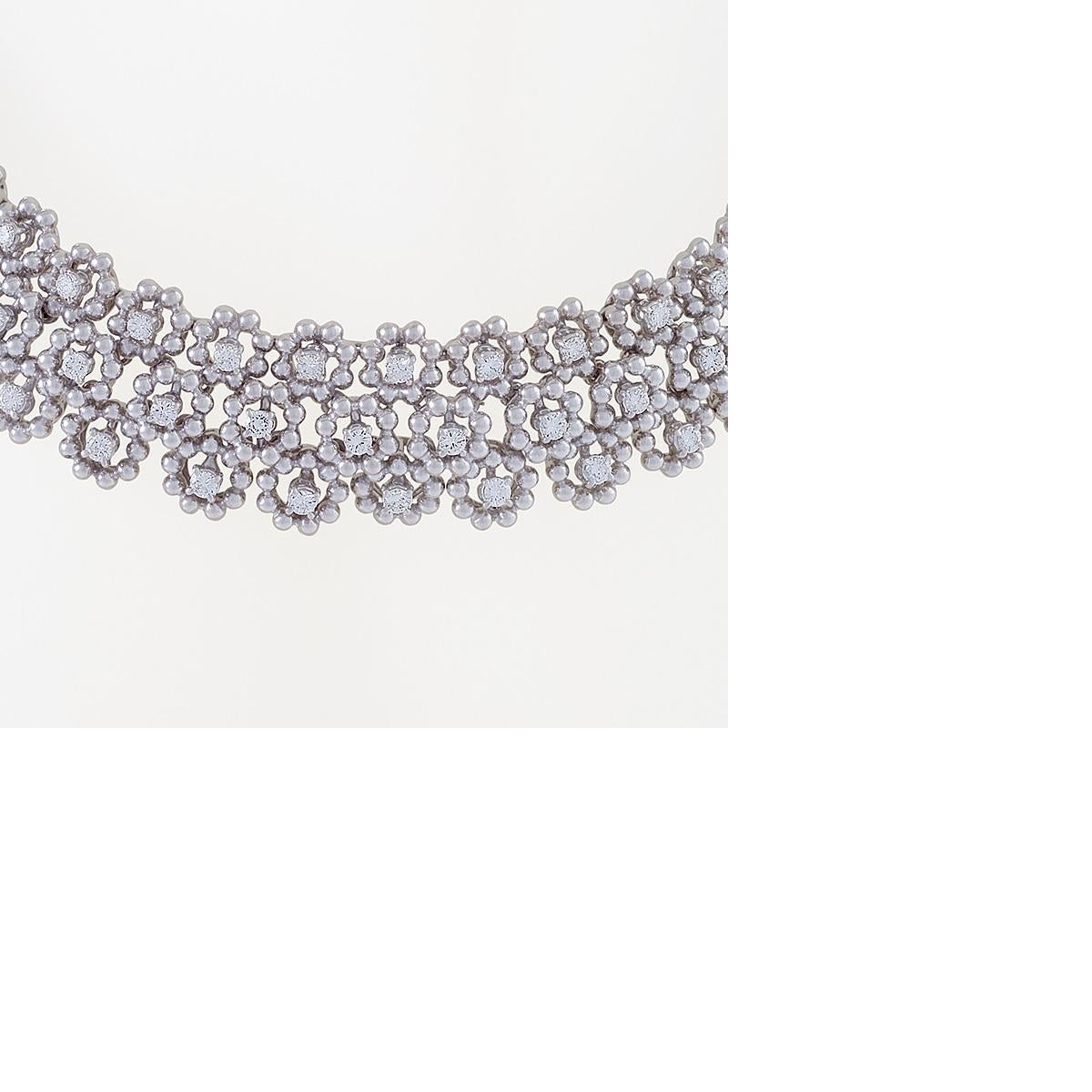 An Italian Mid-20th Century 18 karat white gold necklace with diamonds. The necklace has 138 round-cut diamonds with an approximate total weight of 11.04  carats, G/H color and VS clarity.  The necklace is designed as a series of three rows of