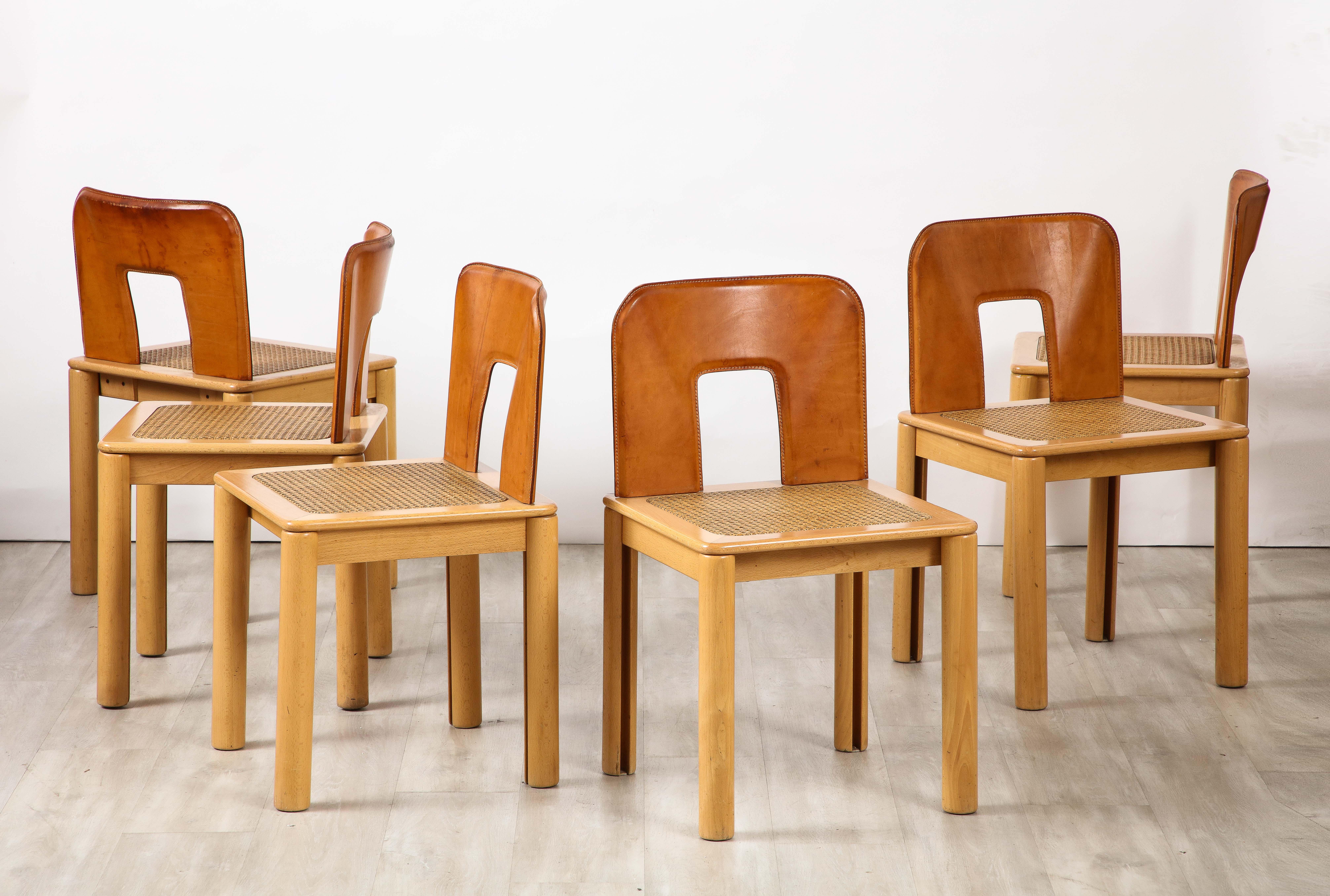 Modern Italian 1970's Dining Chairs with Leather, Wood, Cane Seats, Italy, circa 1970 For Sale