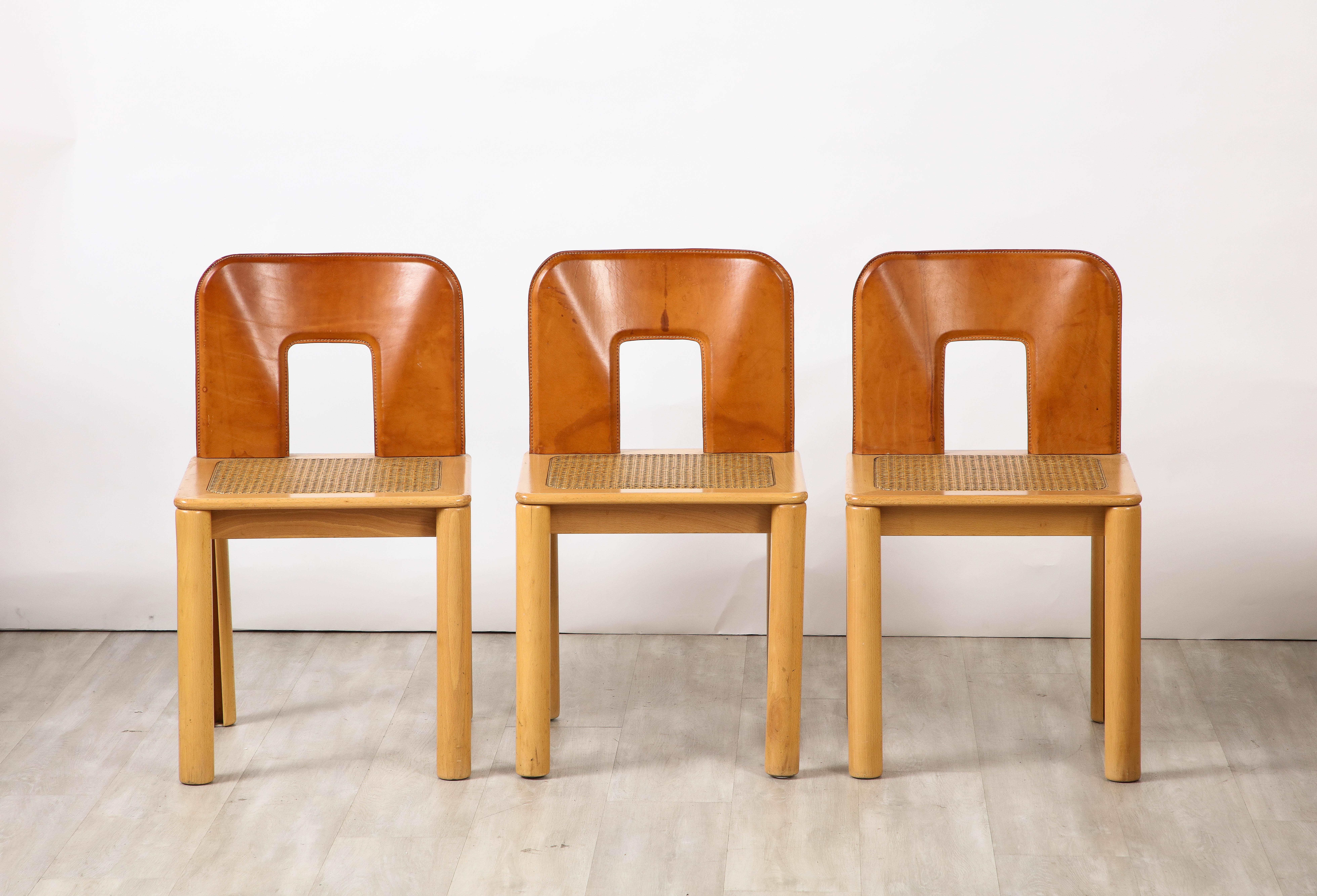 Late 20th Century Italian 1970's Dining Chairs with Leather, Wood, Cane Seats, Italy, circa 1970 For Sale