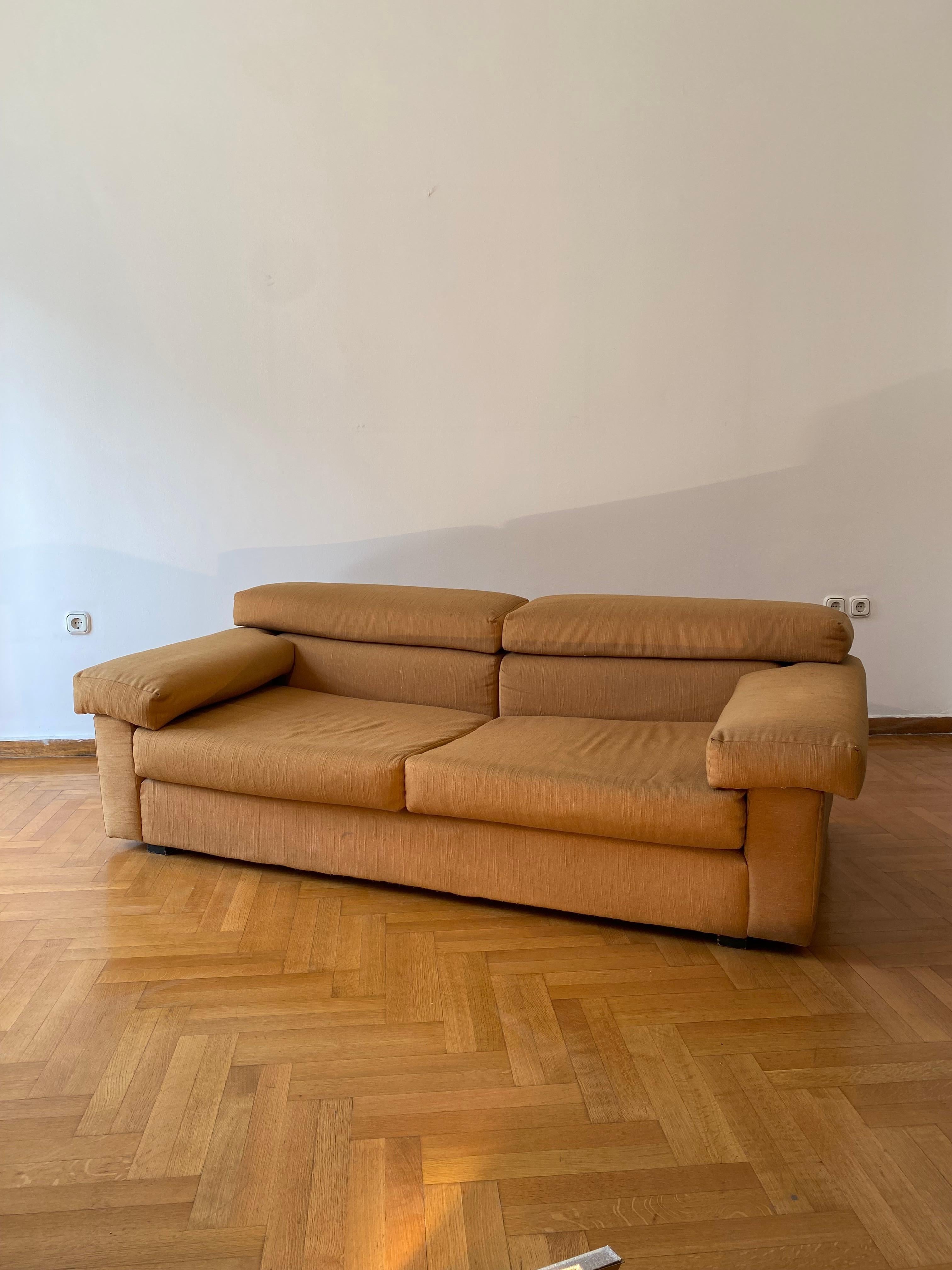 This stunning and amazingly comfortable sofa in the manner of the iconic Erasmo sofa from Afra & Tobia Scarpa for B&B Italia , is a beautiful example of 1970s Italian design. 
Currently upholstered in a terracotta fabric which was changed from its