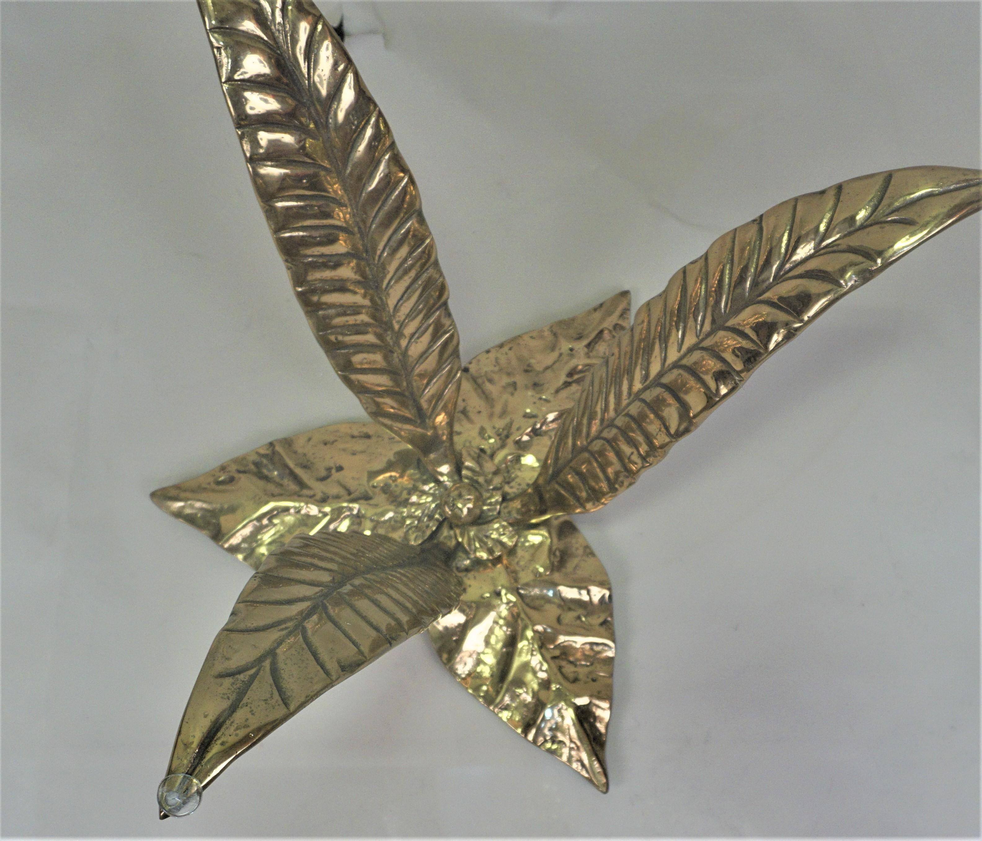 Large bronze leaves sculptural coffee table base with glass top.