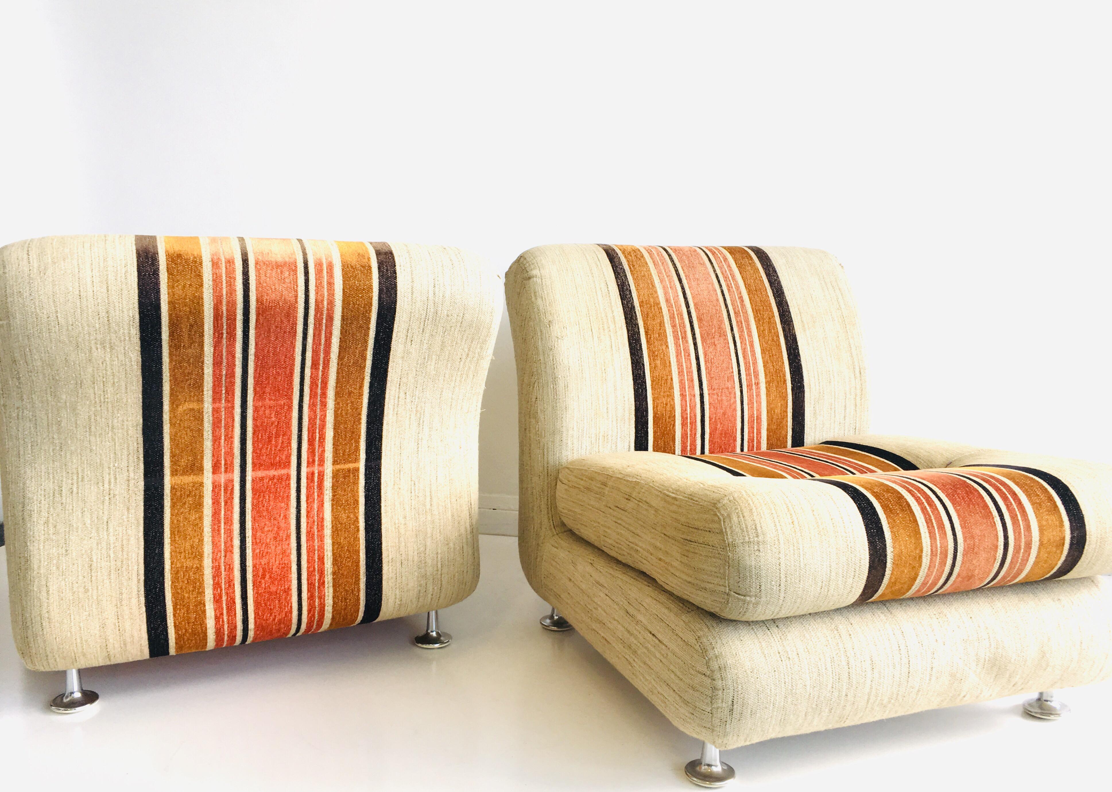 Stylish 1970s pair of Italian Lowline lounge chairs. These present in good original order, upholstered in a lovely original striped 1970s fabric. Extremely comfortable and can be easily configured to form a compact sofa, if desired.

Wear
