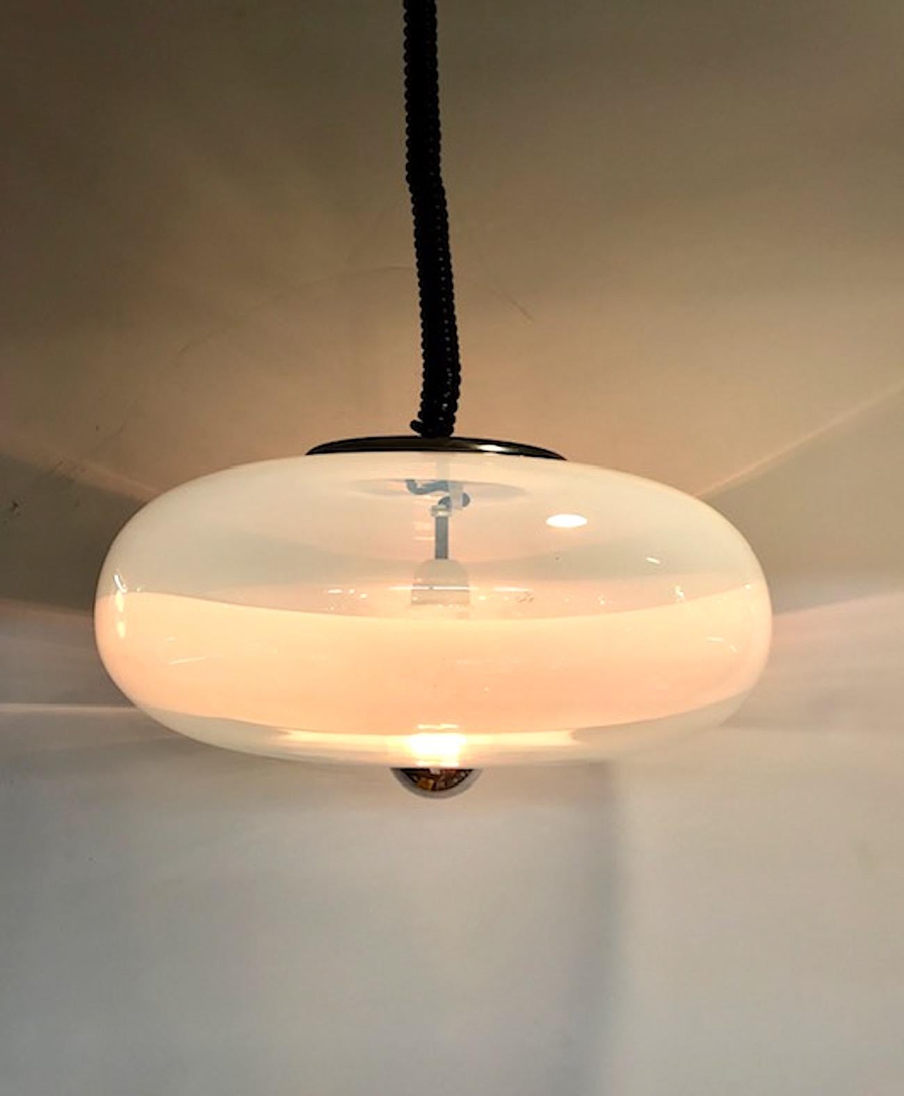 Murano glass bubble pendant light, circa 1970, in the style of Italian lighting company Sothis. The hand blown glass shade is pale translucent white opaline with transparent white stripe. The bottom centre of the donut shade has a standard socket