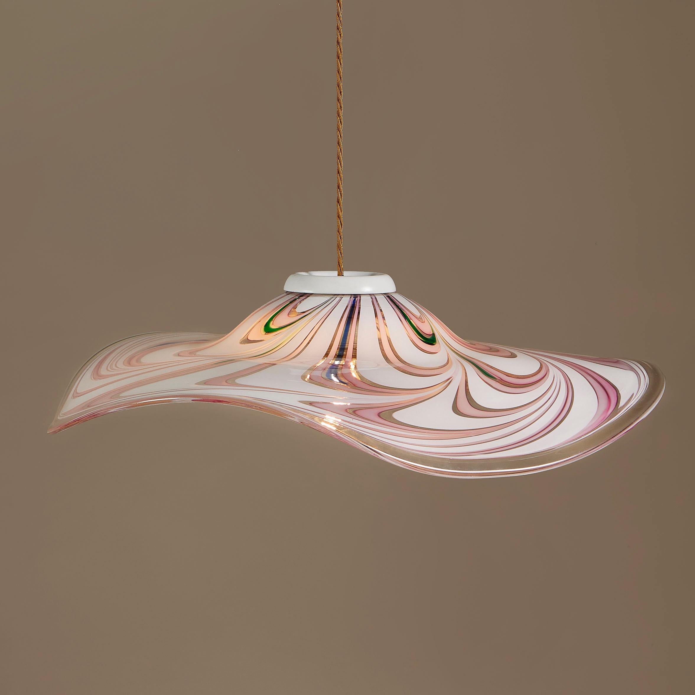 Wide undulating Murano glass pendant with bold pink, white and clear swirl pattern with a splash of blue and green at the top.

