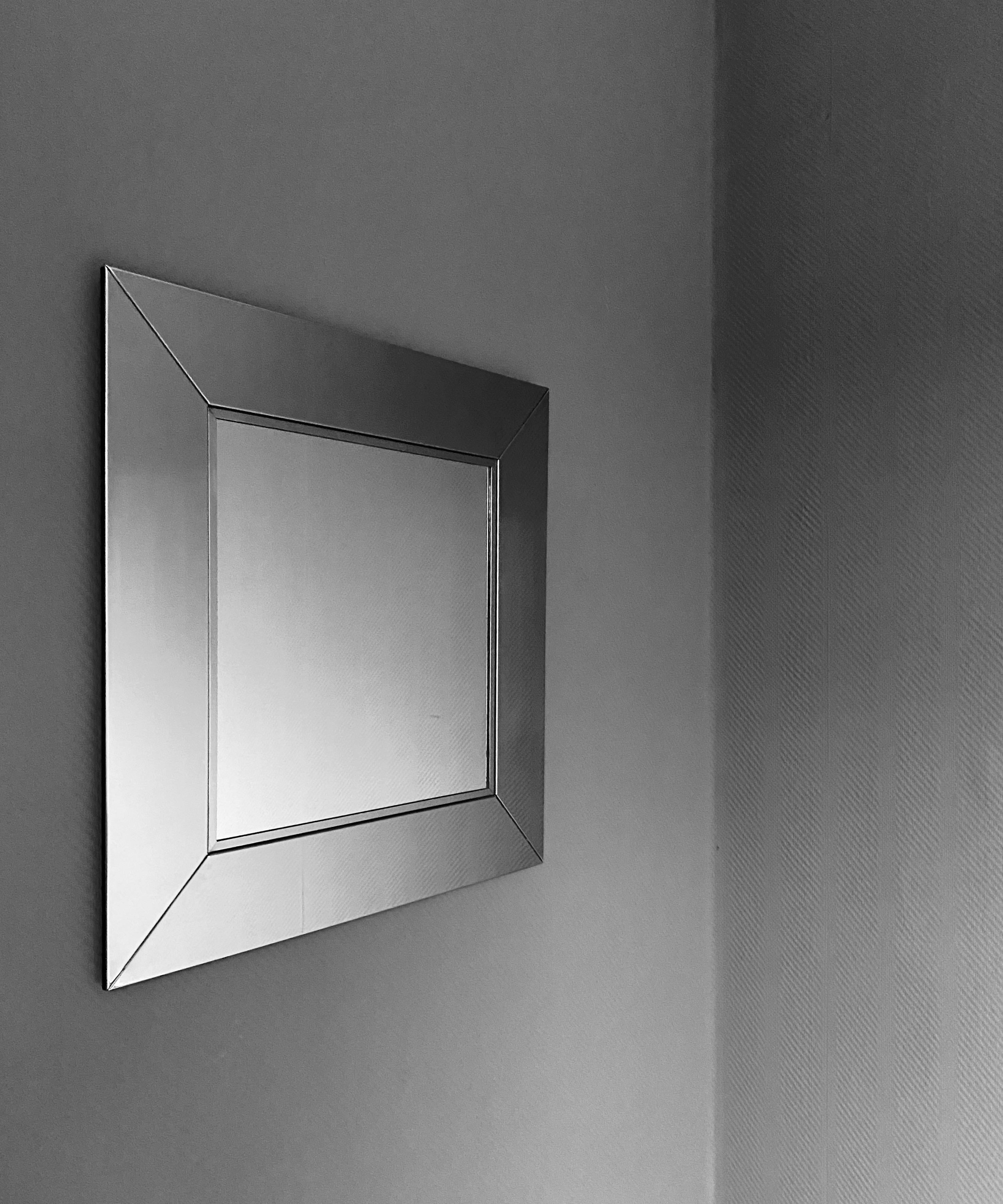 Italian 1970's wall mirror with large stainless steel frame in great condition. The attributed manufacturer of this stylish piece is Valenti Italy.
The mirror will be shipped insured overseas in a custom made wooden crate. Cost of transport is crate