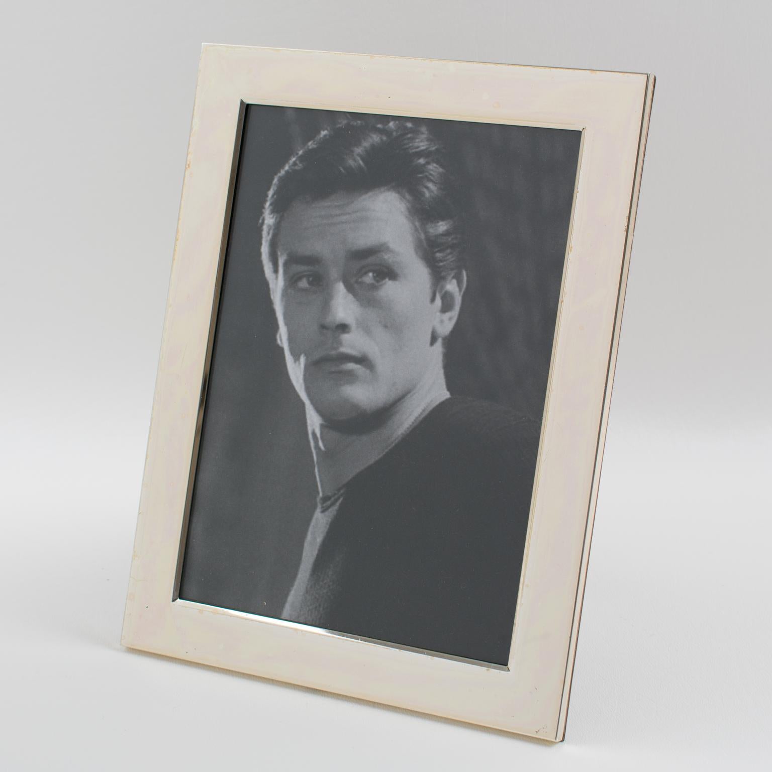 Elegant Italian picture photo frame. A timeless polished silver plate in a streamlined design. Rich high gloss walnut wood back and easel. Marked on the easel 
