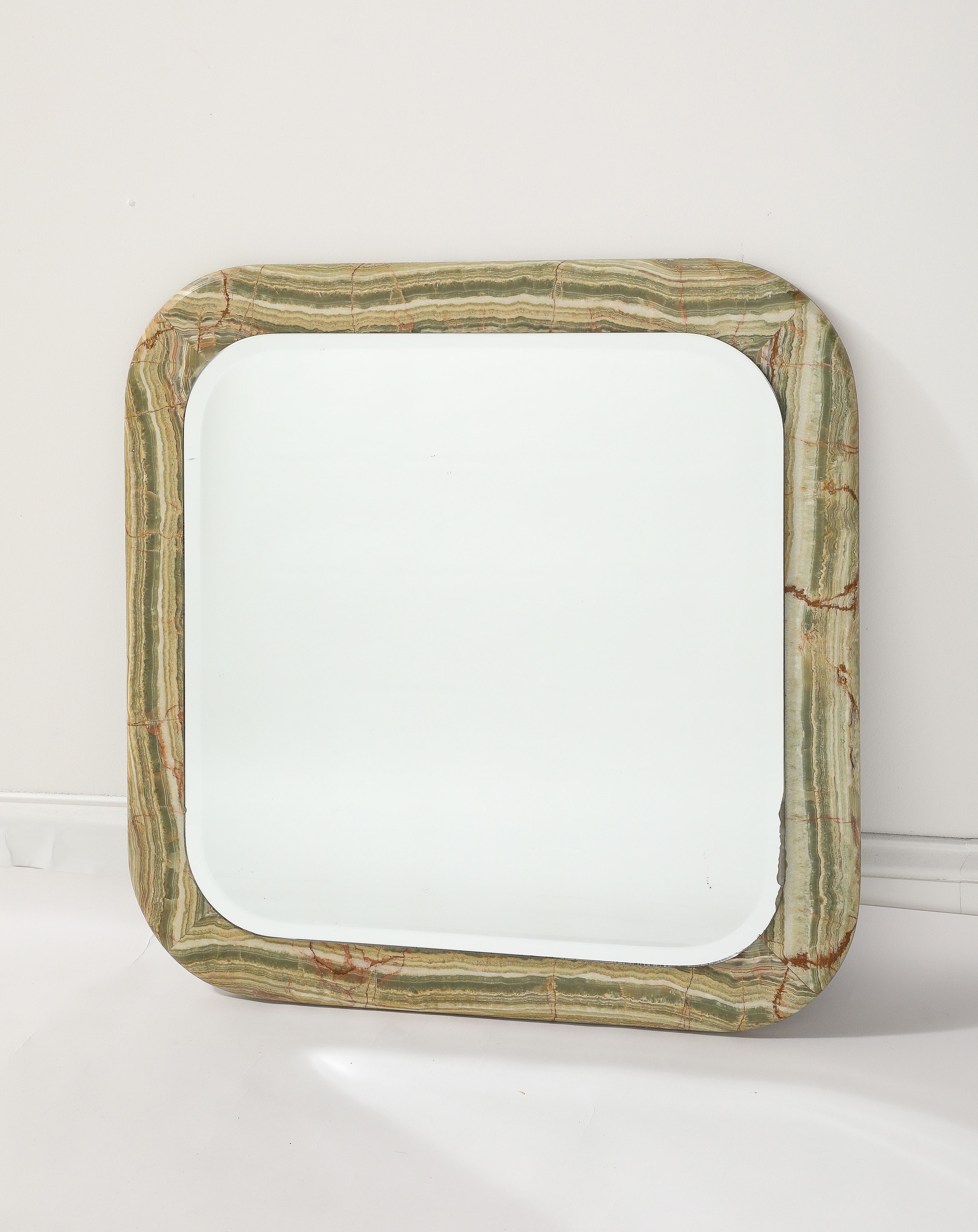 An Italian 1970's square marble mirror; with fantastic coloration and thick beveled mirror glass.  Highly unique and wonderfully designed. 
Italy, circa 1970 
Size: 25 1/2