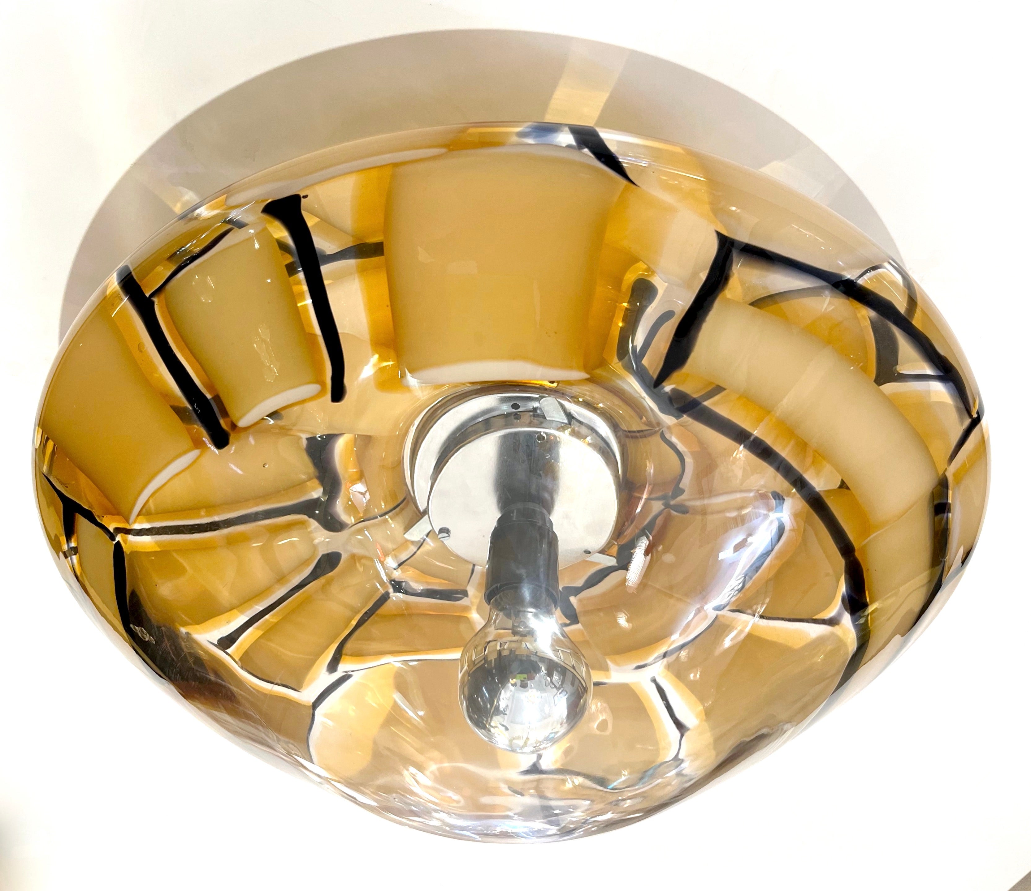 A rare 1970s Italian light fixture by Ercole Barovier that can be flush mount or wall light and in excellent original condition. The polished nickel backplate supports a blown crystal clear Murano glass round shade of organic feel, worked 