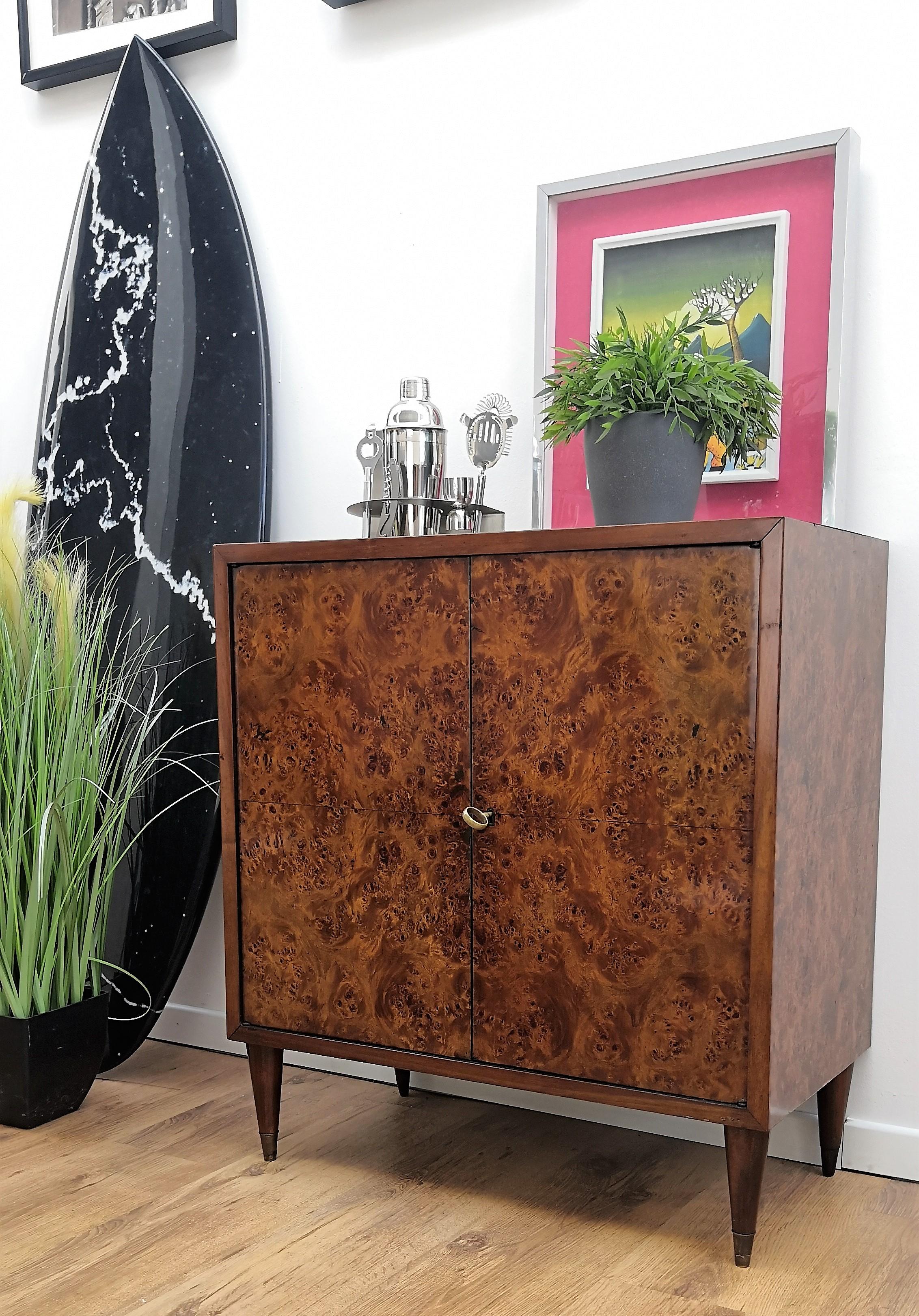 Very elegant Italian Art Deco Mid-Century Modern dry bar cabinet, in beautiful veneer walnut briar burl wood, two doors with amazing interior part in mirrors mosaic and antique gilt brass feet and one key. The unique and typical design and shapes