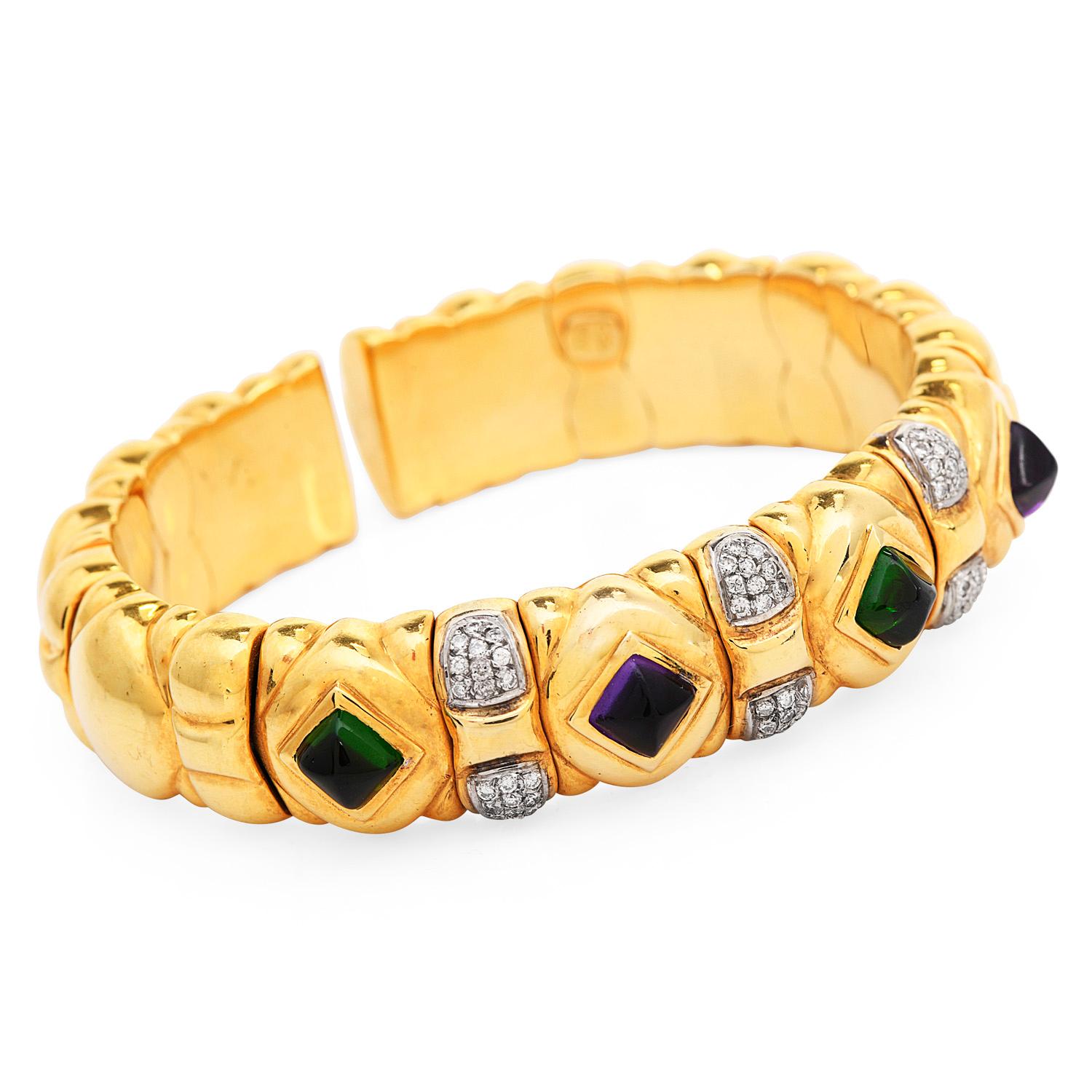 This chic statement Italian bracelet circa1980 is crafted in 18-karat yellow gold, weighing 85.0  grams and measuring approx. 7 inches around the wrist x 14mm wide.

Showcasing 60 fancy  Sugarloaf Cabochon amethyst and peridot bezel-set collectively